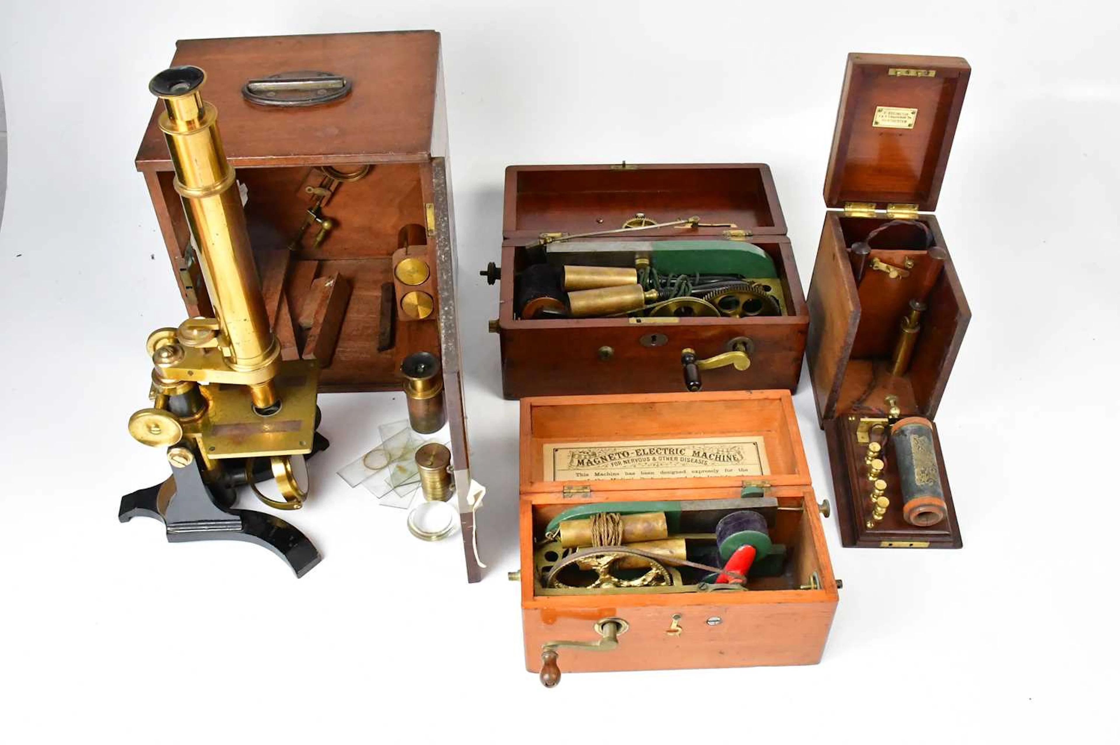 A boxed Victorian monocular lacquered brass microscope by Maurice Cohen & Co
