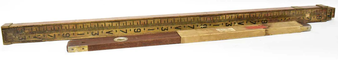 A vintage surveyor's three-sectioned telescopic measuring stick