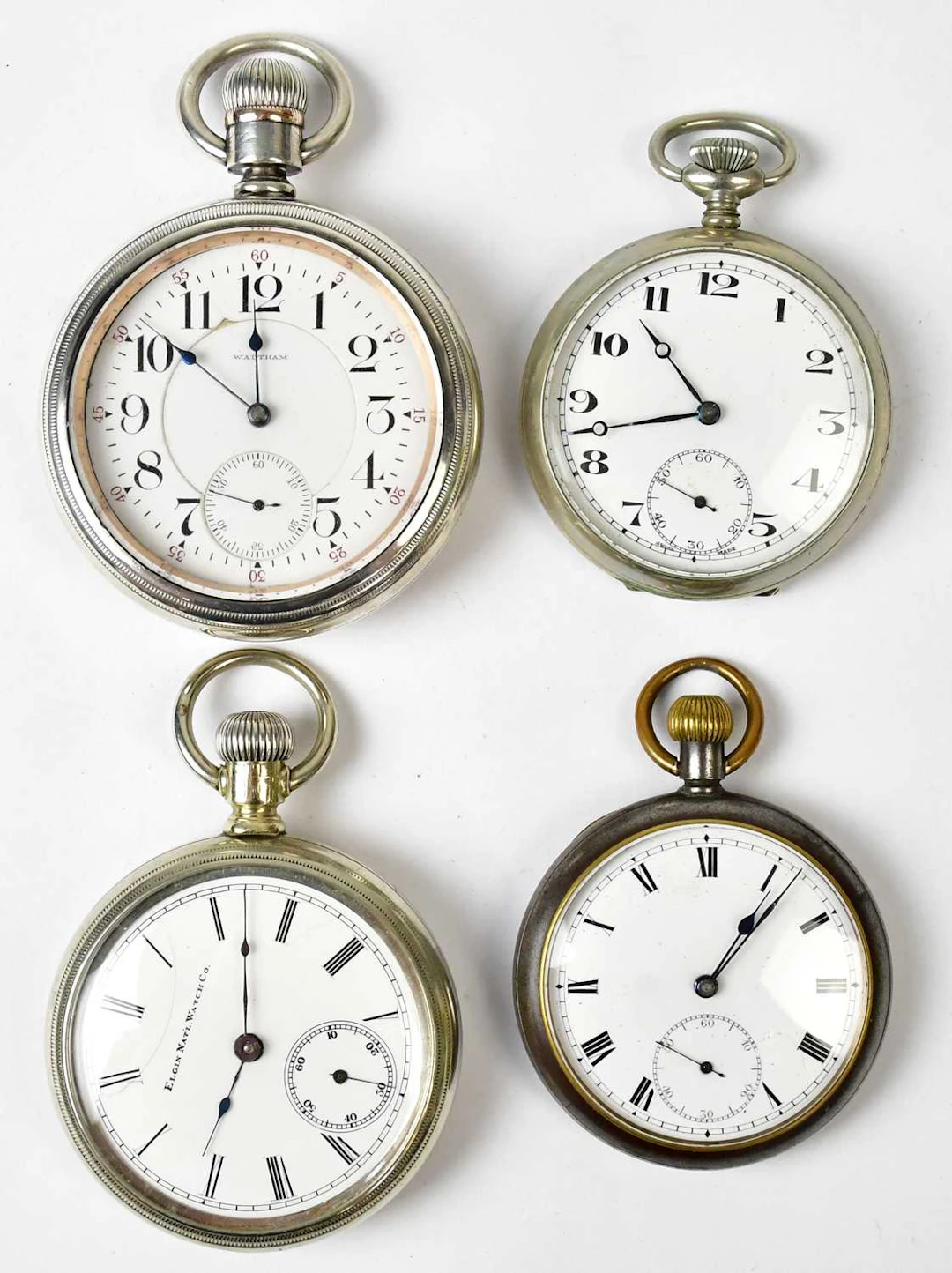 Four silver-plated open face crown wind pocket watches