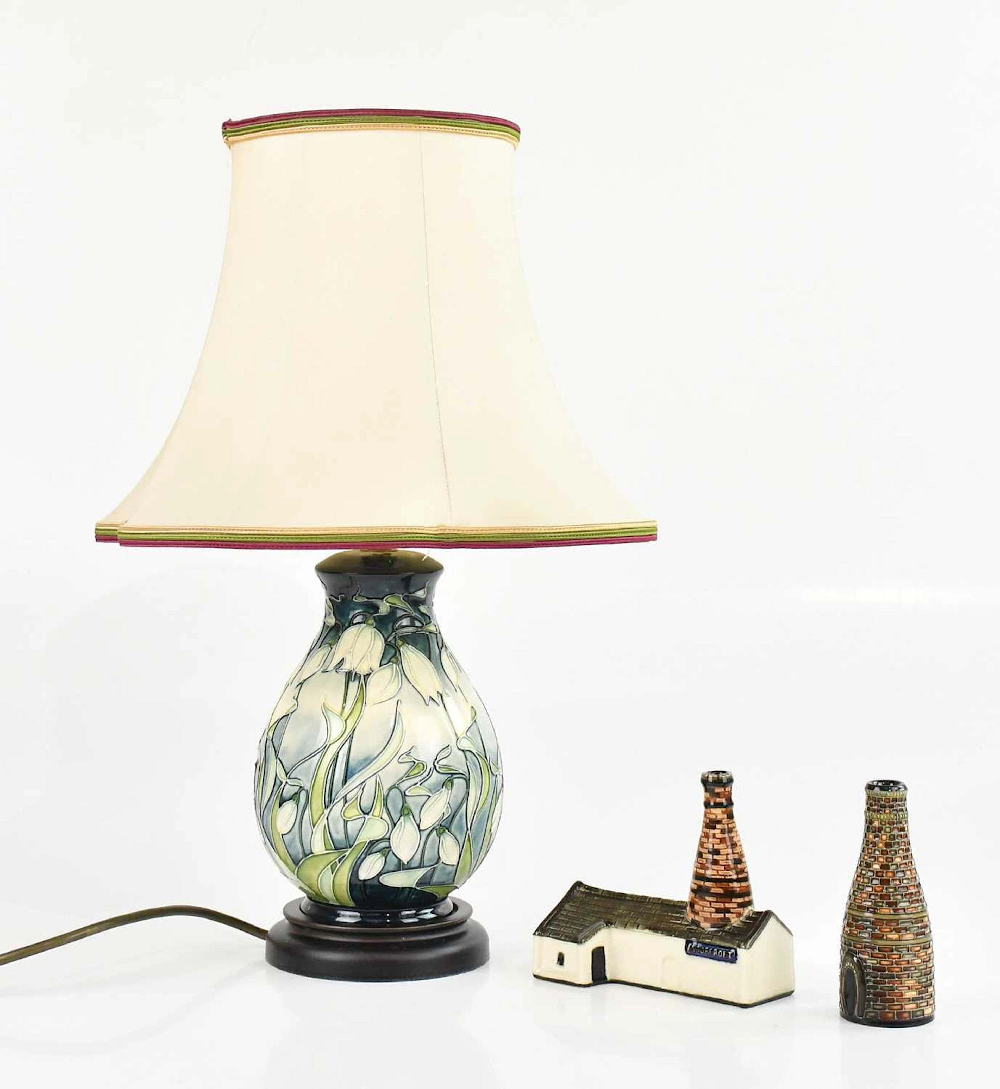 MOORCROFT; a baluster shaped table lamp in the 'Snowdrop' pattern