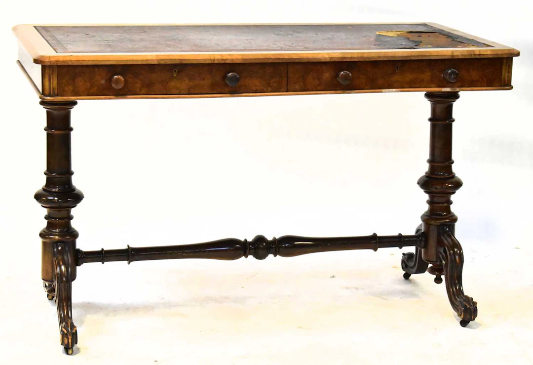 A Victorian figures walnut writing table