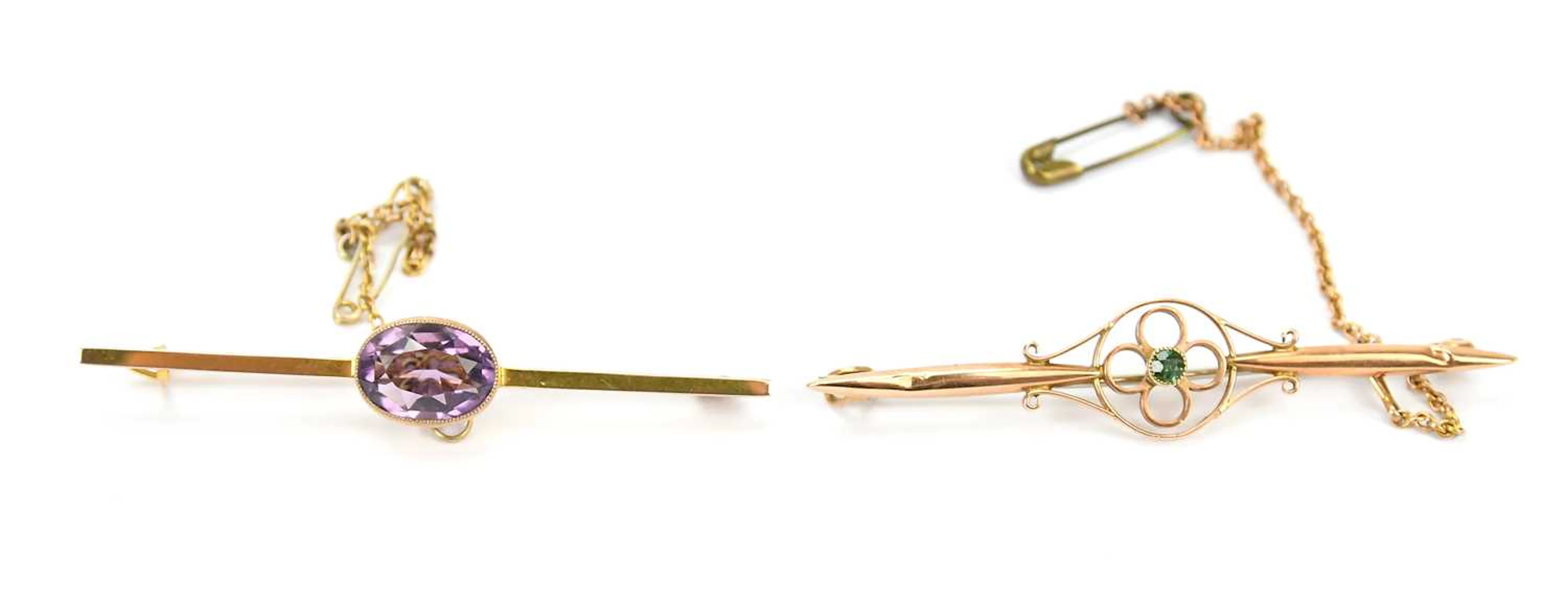 A yellow metal amethyst set brooch