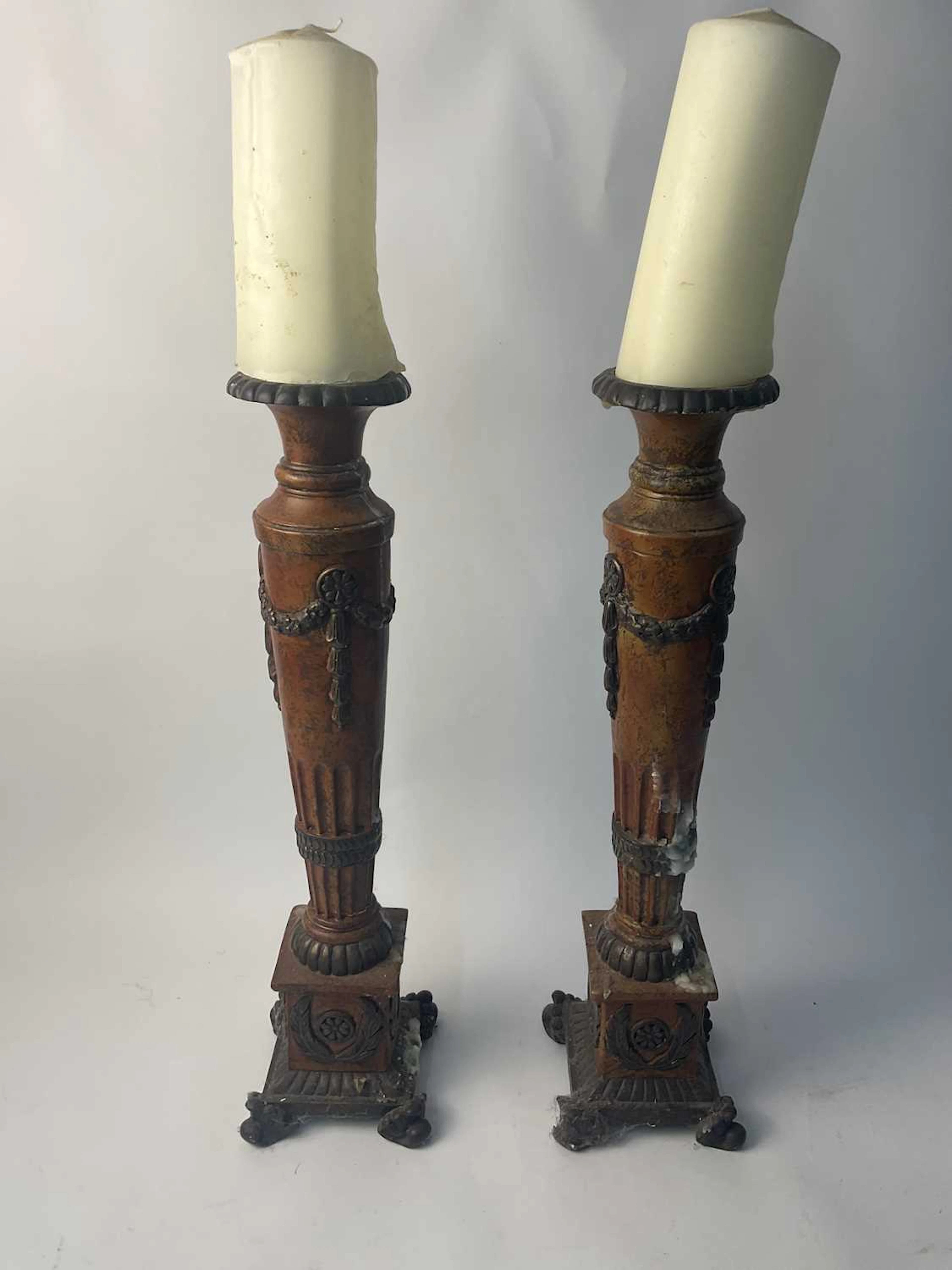 A pair of neo-classical resin candle stands