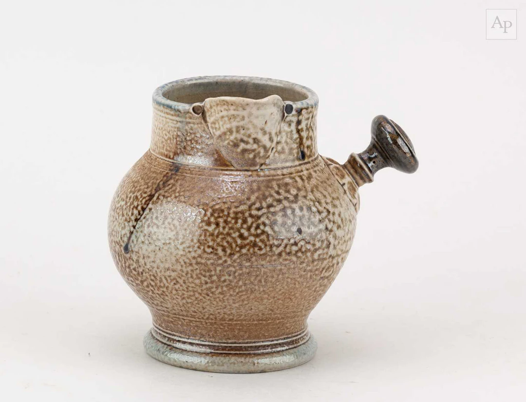 STEVE HARRISON (born 1967); a salt glazed jug with side handle and indented side