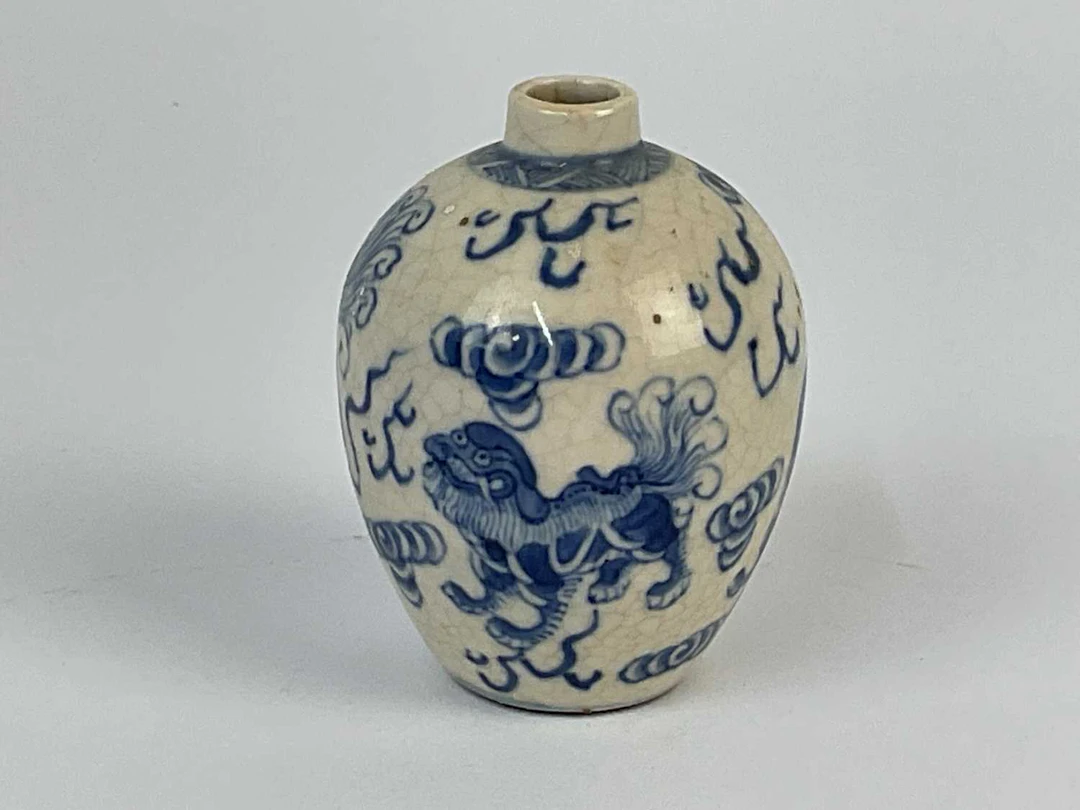 A Chinese blue and white crackle glaze miniature vase...