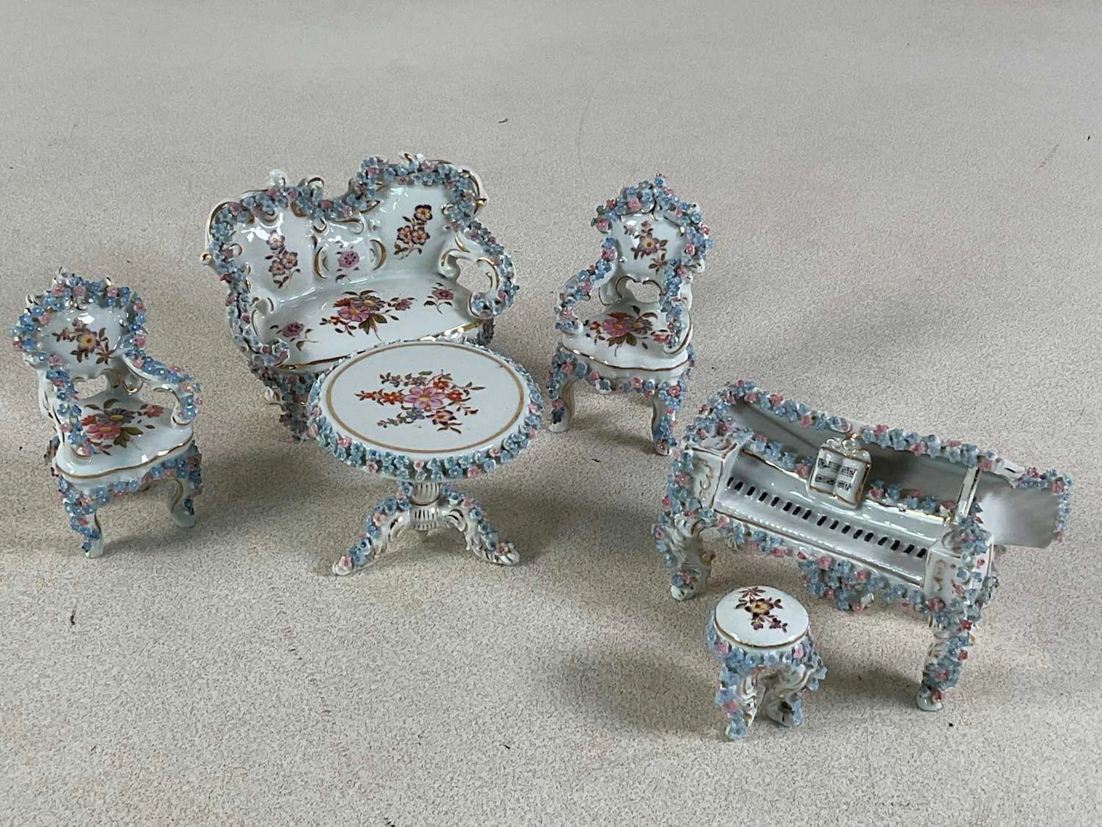 An early 20th century German floral encrusted porcelain...