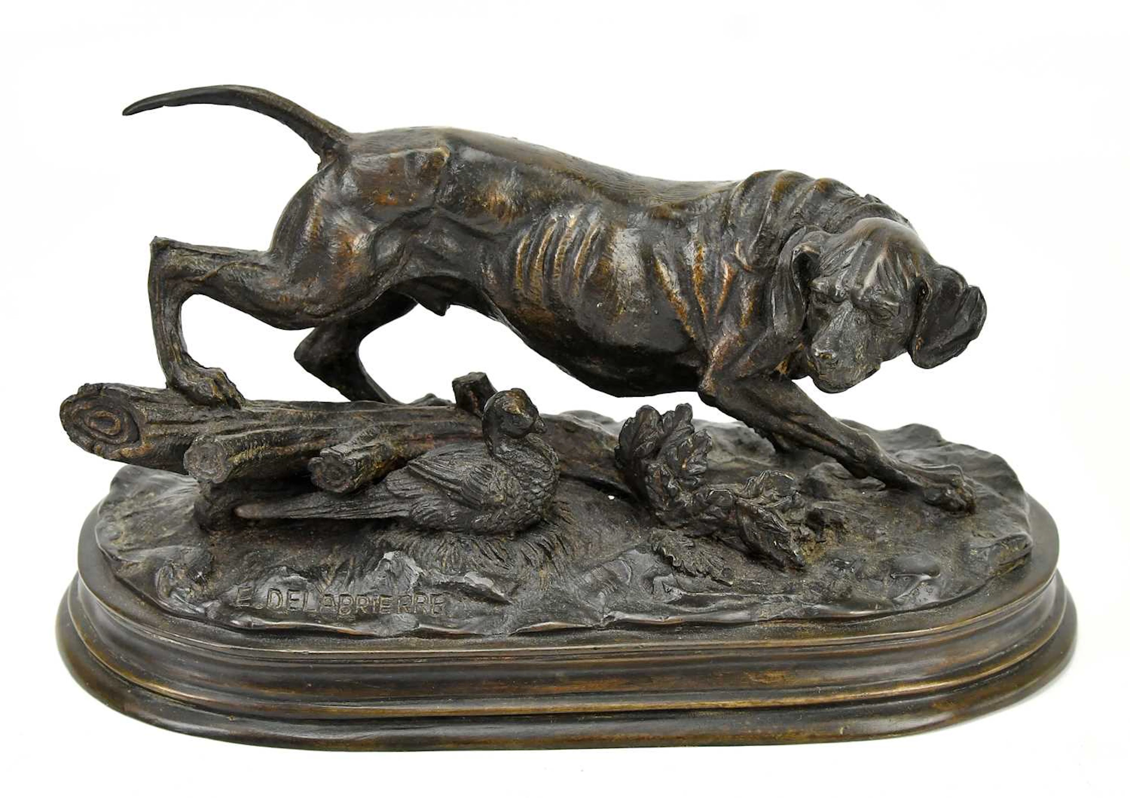 A bronze figure of hunting dog and pheasant