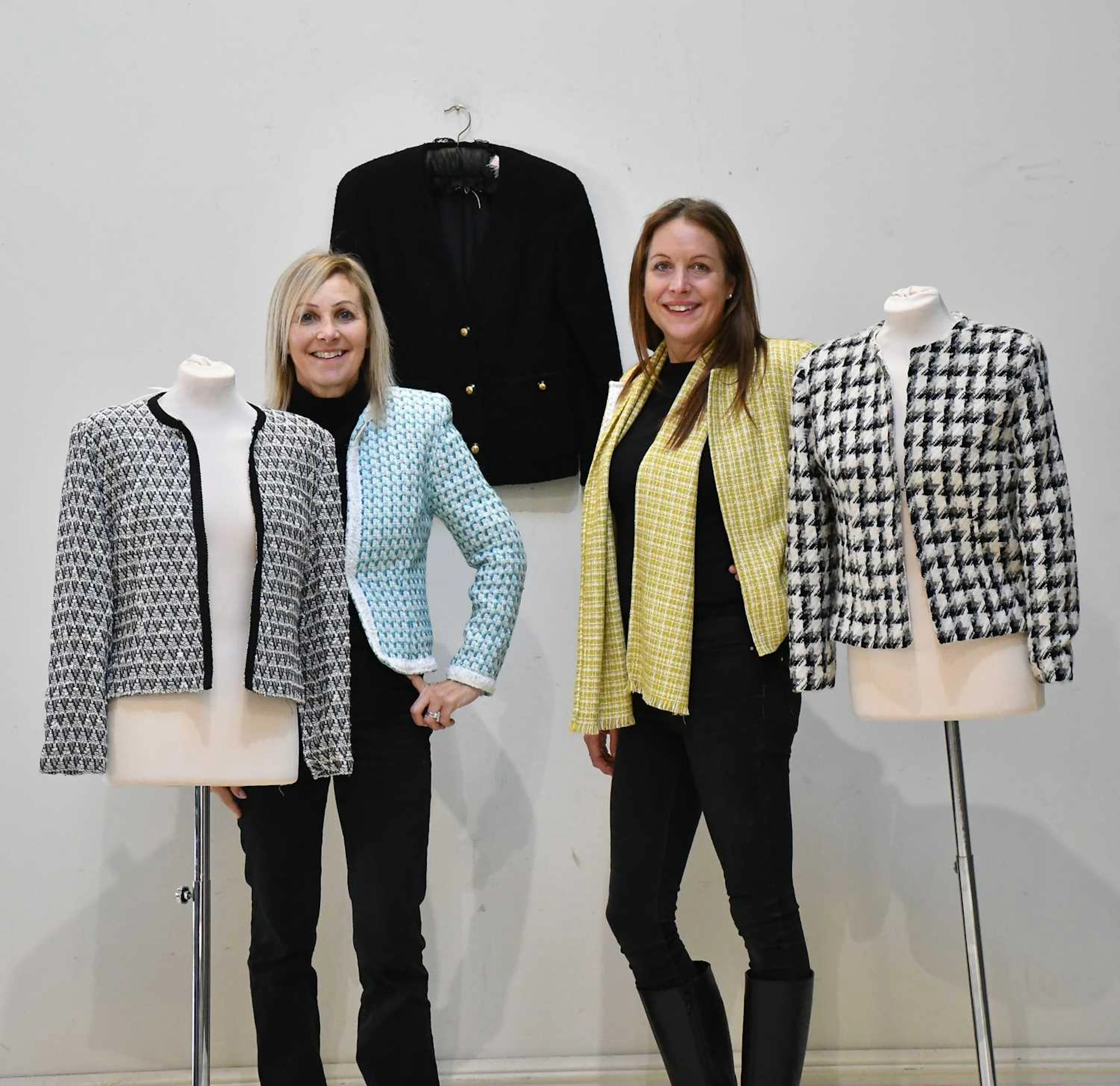 CHANEL; a black bouclé short jacket with V-neck