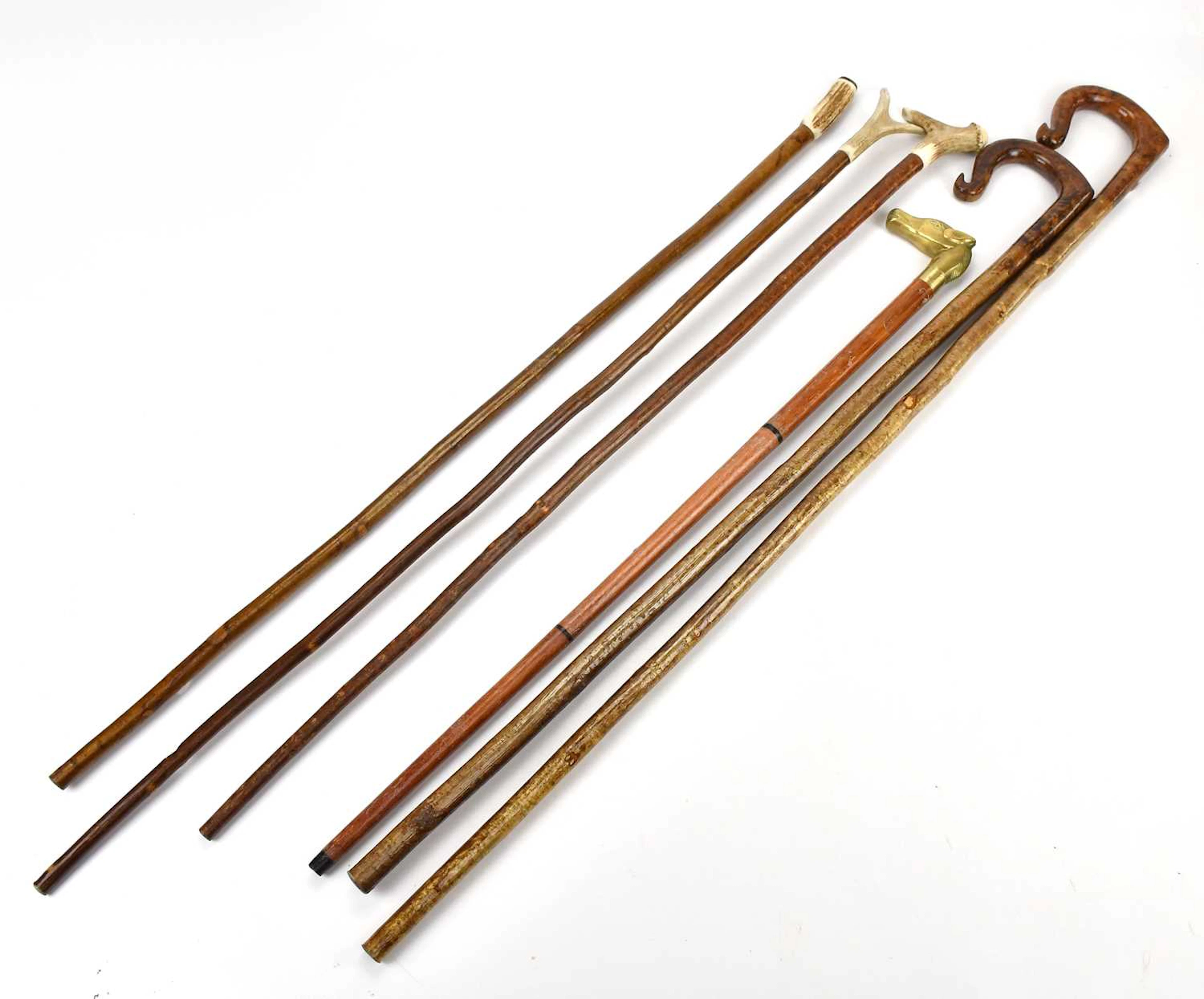 A group of six walking sticks including antler handled examples