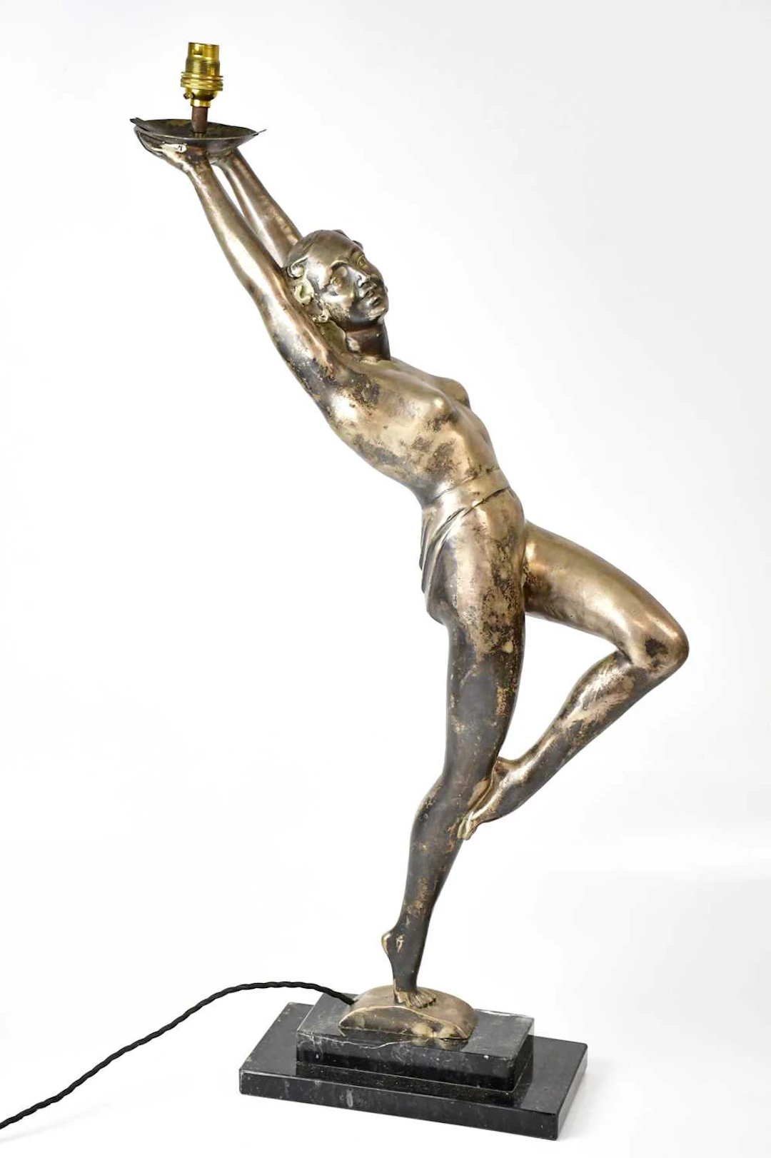 An Art Deco style cast metal figural lamp in the form of...