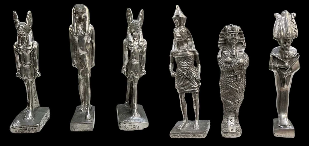 Six assorted Egyptian Revival pewter figures