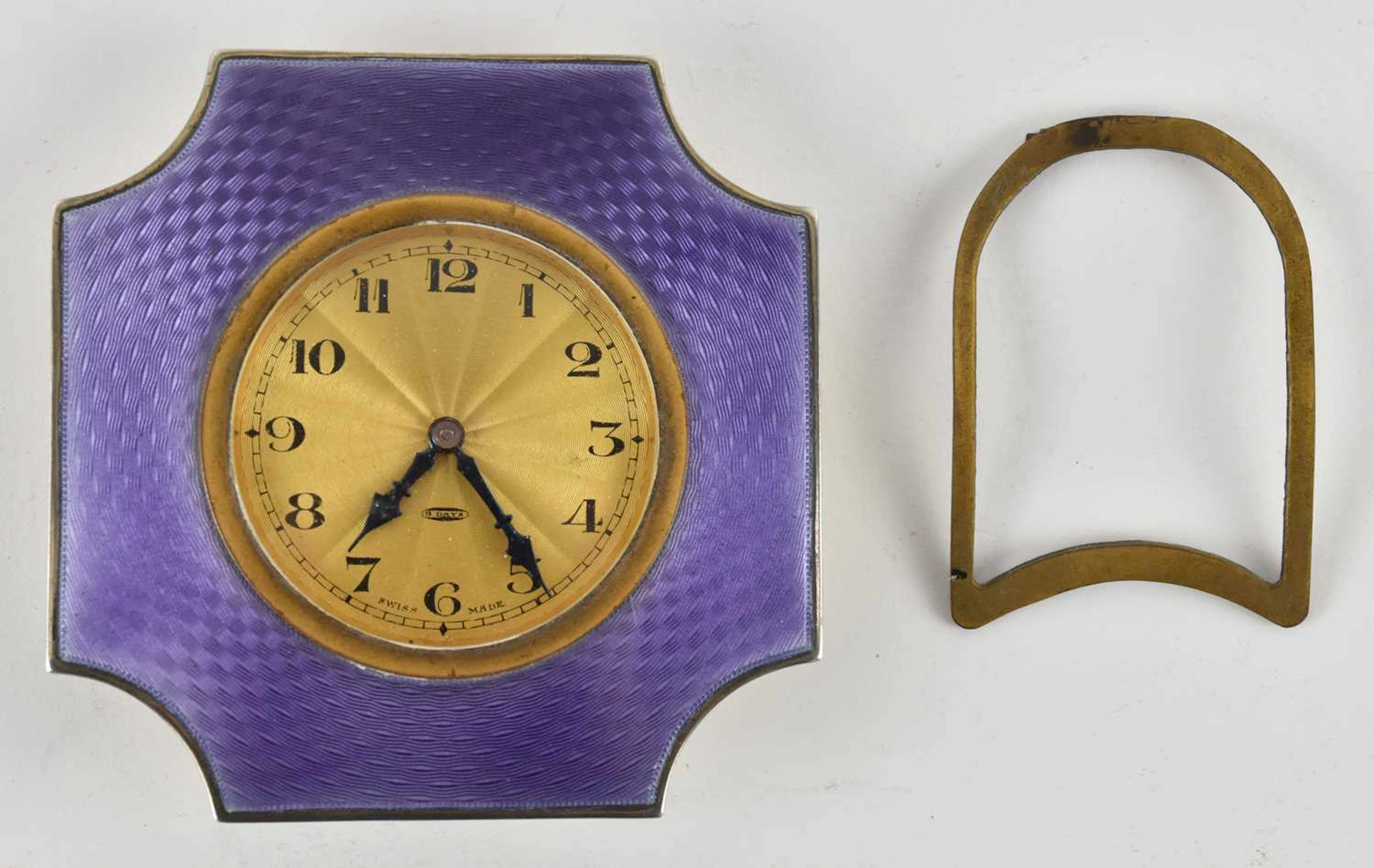 HENRY MATTHEWS; a George V hallmarked silver Art Deco dressing table top clock