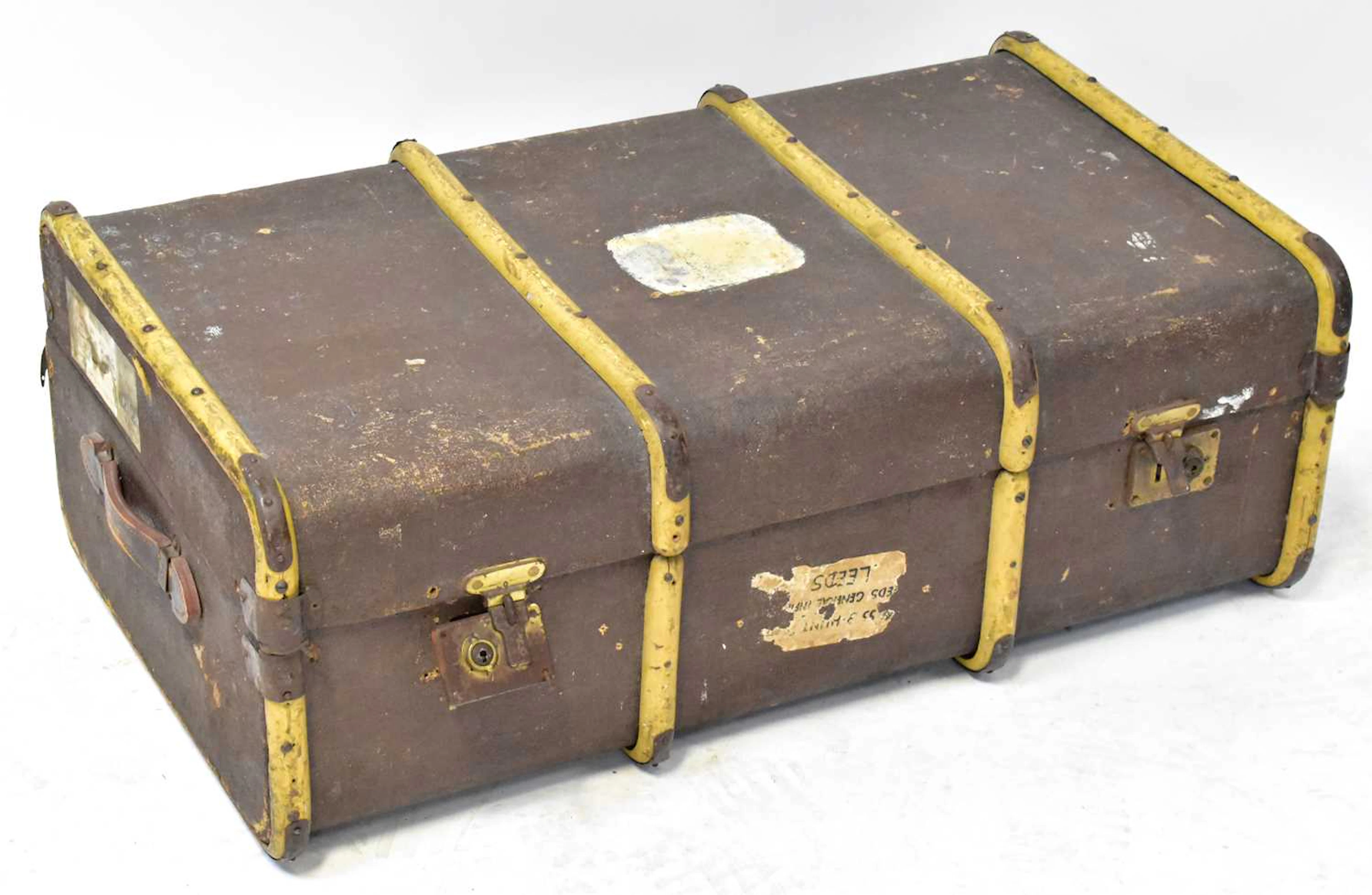A vintage wooden bound steamer suitcase