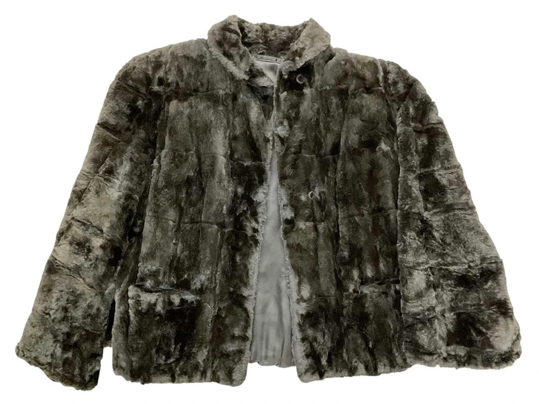 A vintage lady's black fur coat