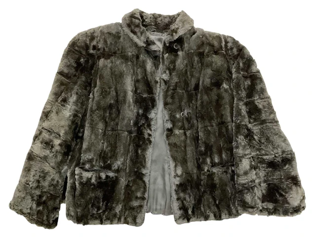 A vintage lady's black fur coat