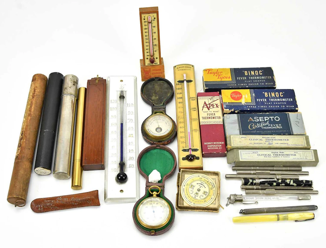 MONAGHAN JEWELLERS INC; a sterling silver and mother of pearl thermometer