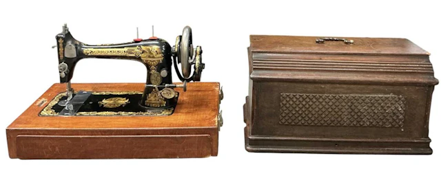 An early 20th century cased Singer sewing machine