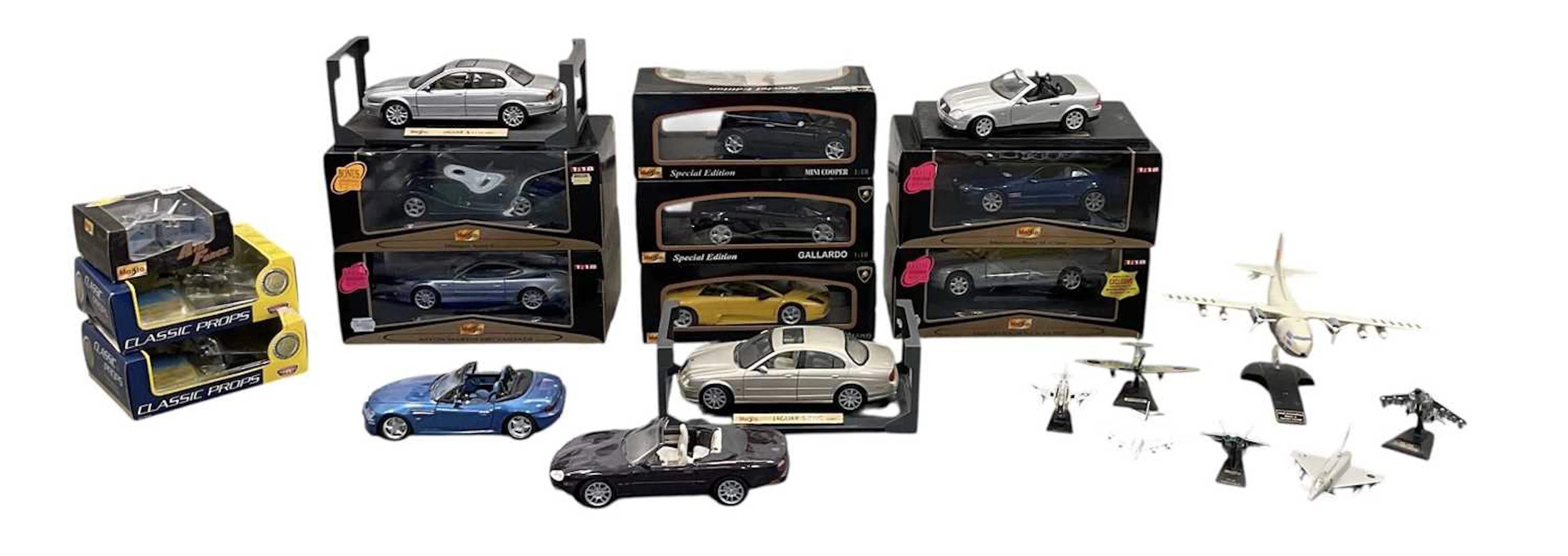 A quantity of toys and model scale vehicles including Maisto Mini Cooper
