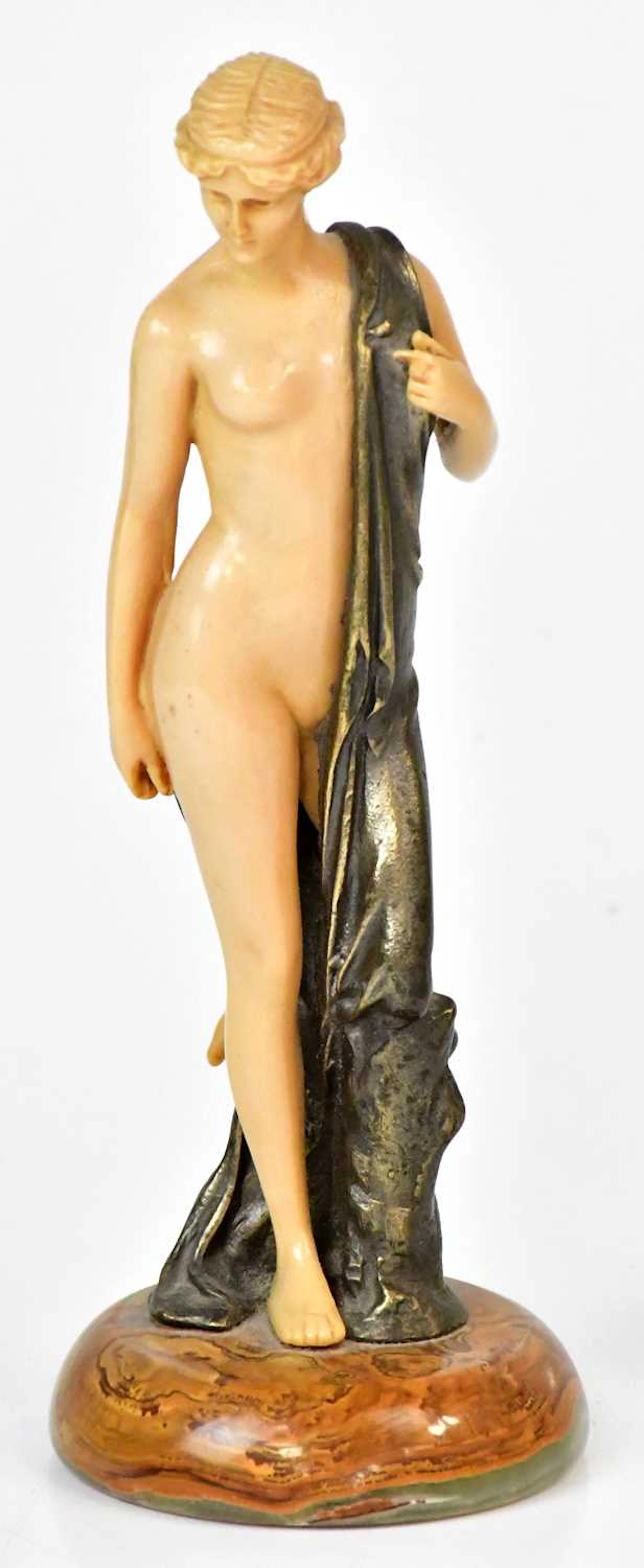 AFTER FERDINAND PREISS; an Art Deco celluloid and bronzed...