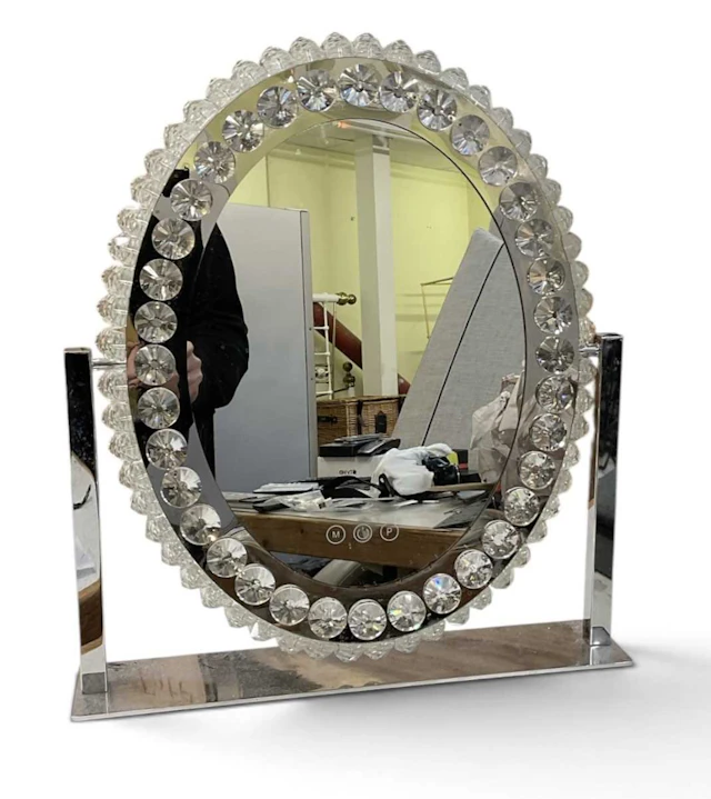 A modern contemporary chrome stainless steel oval...