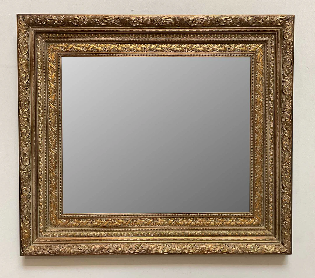 A reproduction 19th century style gilt wall mirror