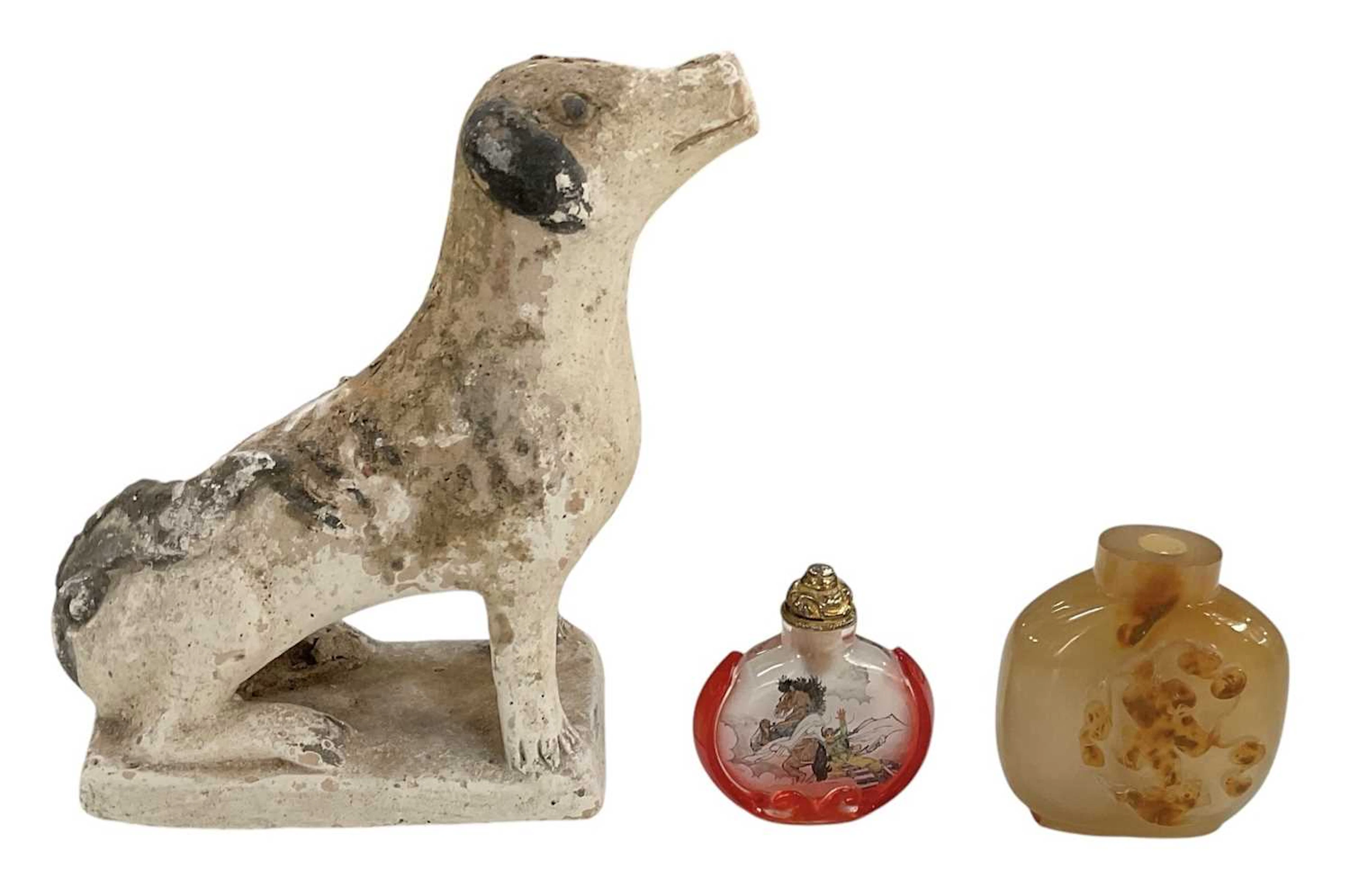 A Chinese Tang dynasty style terracotta figure of a seated dog