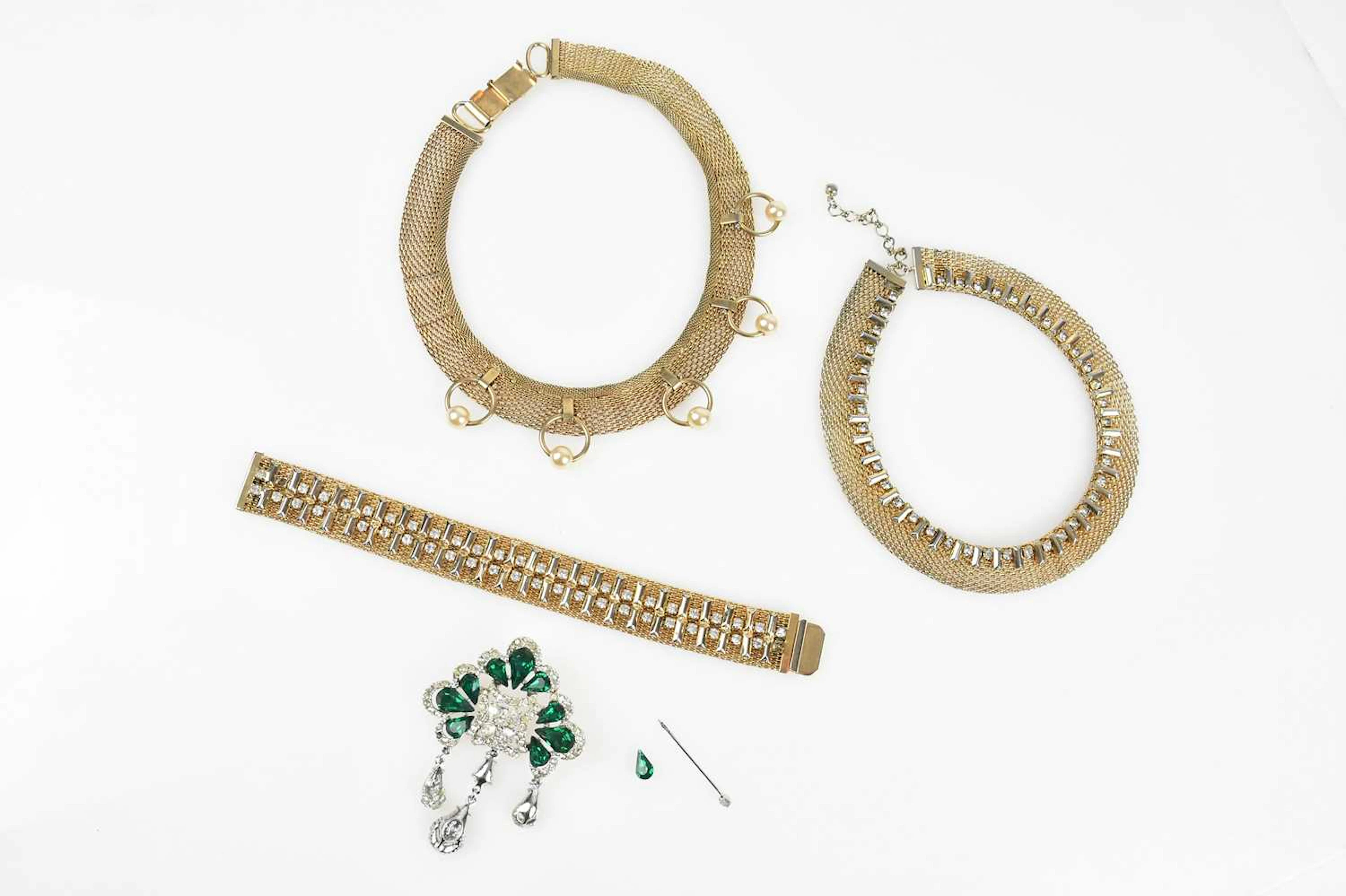 HATTIE CARNEGIE; two gold tone mid 20th century chain metal necklaces