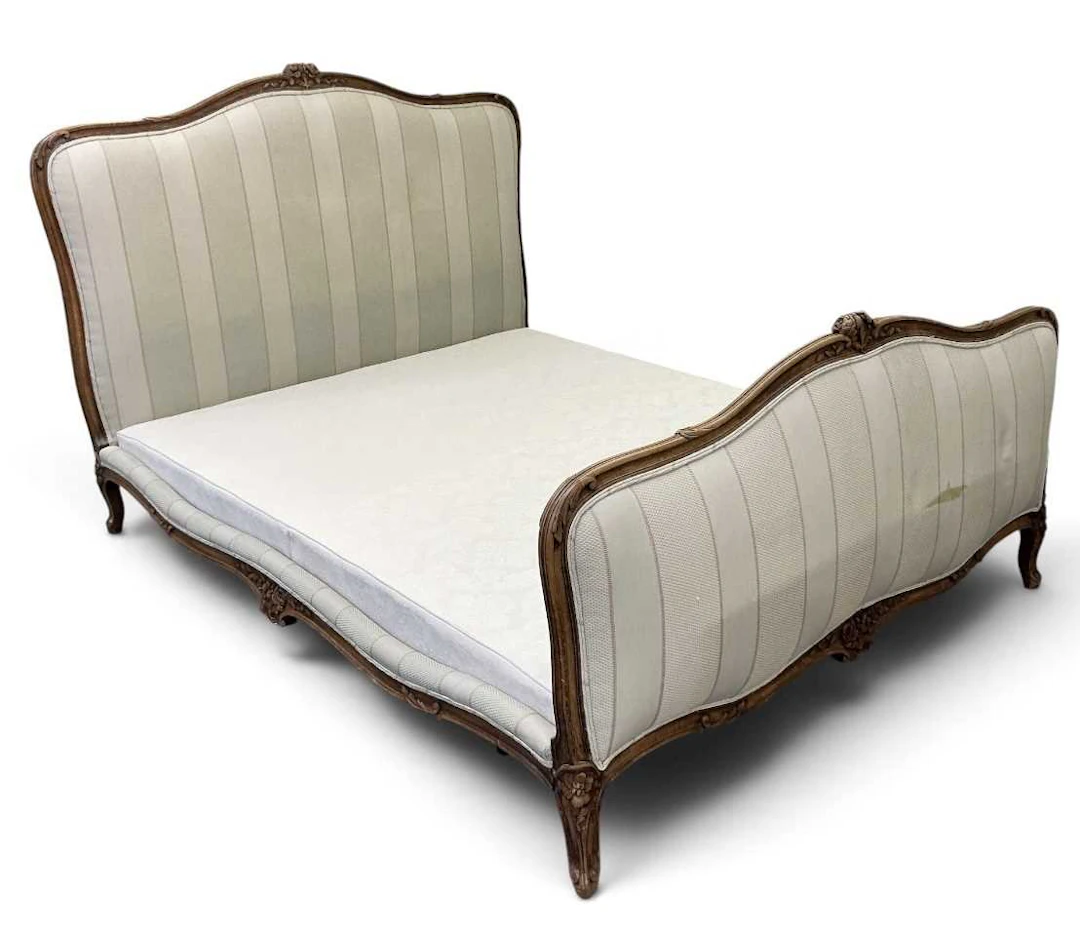 A 19th century French carved mahogany framed striped...