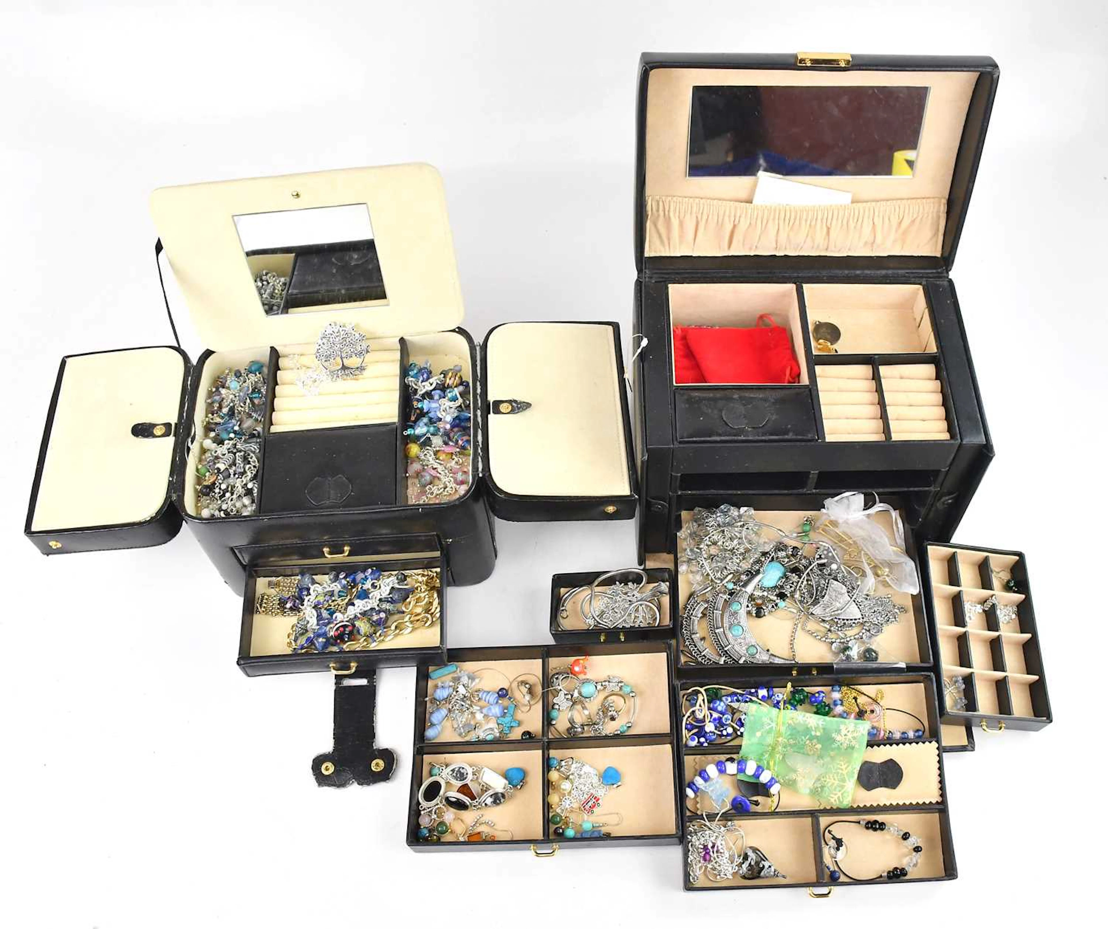 A large collection of costume jewellery including various charm bracelets