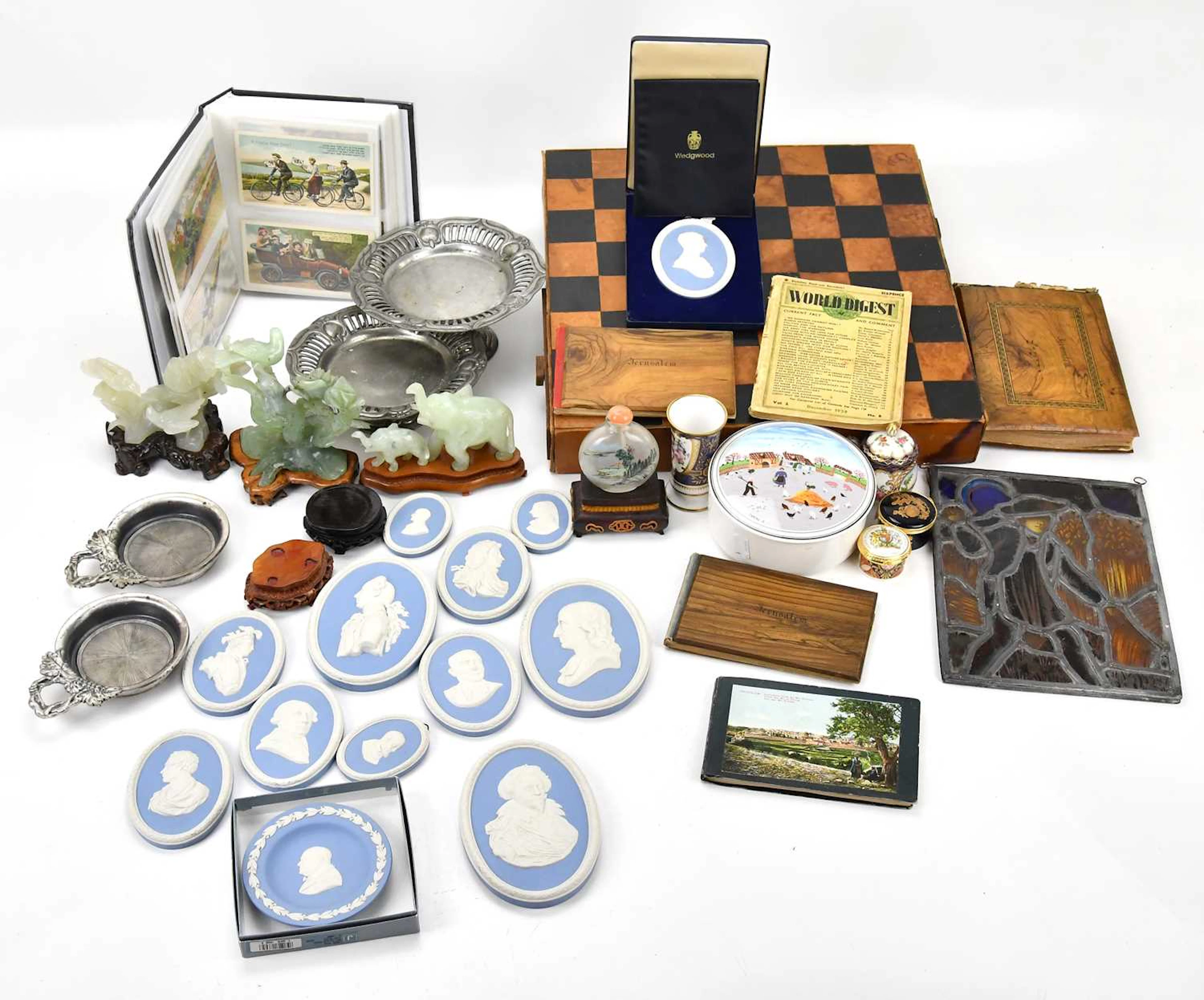 A quantity of collectors' items including green hardstone figures and stands