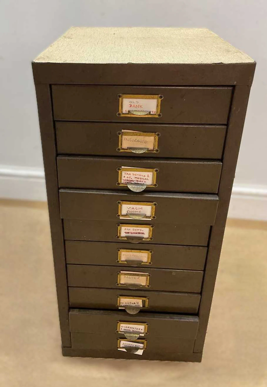 A small ten drawer filing cabinet