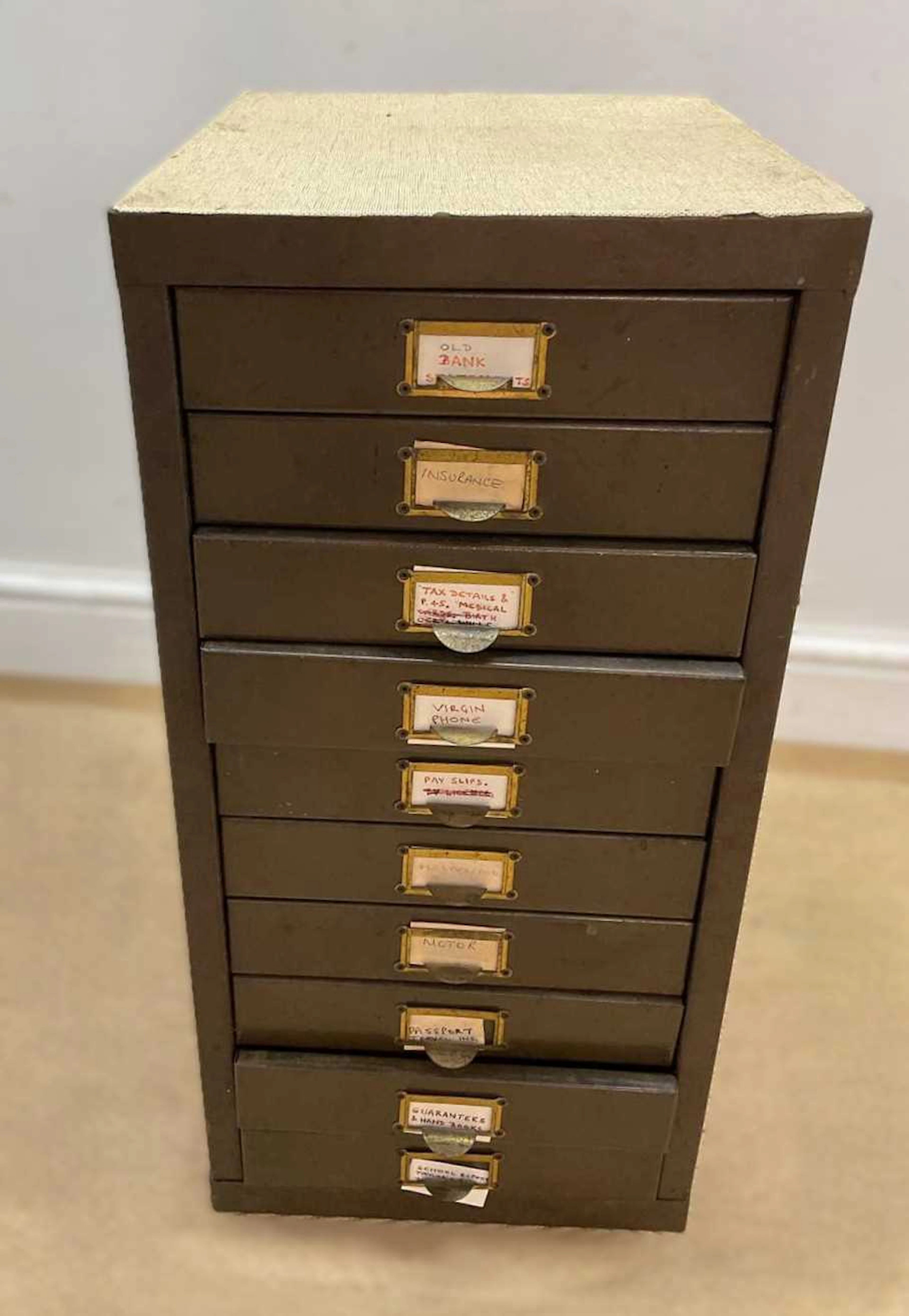 A small ten drawer filing cabinet