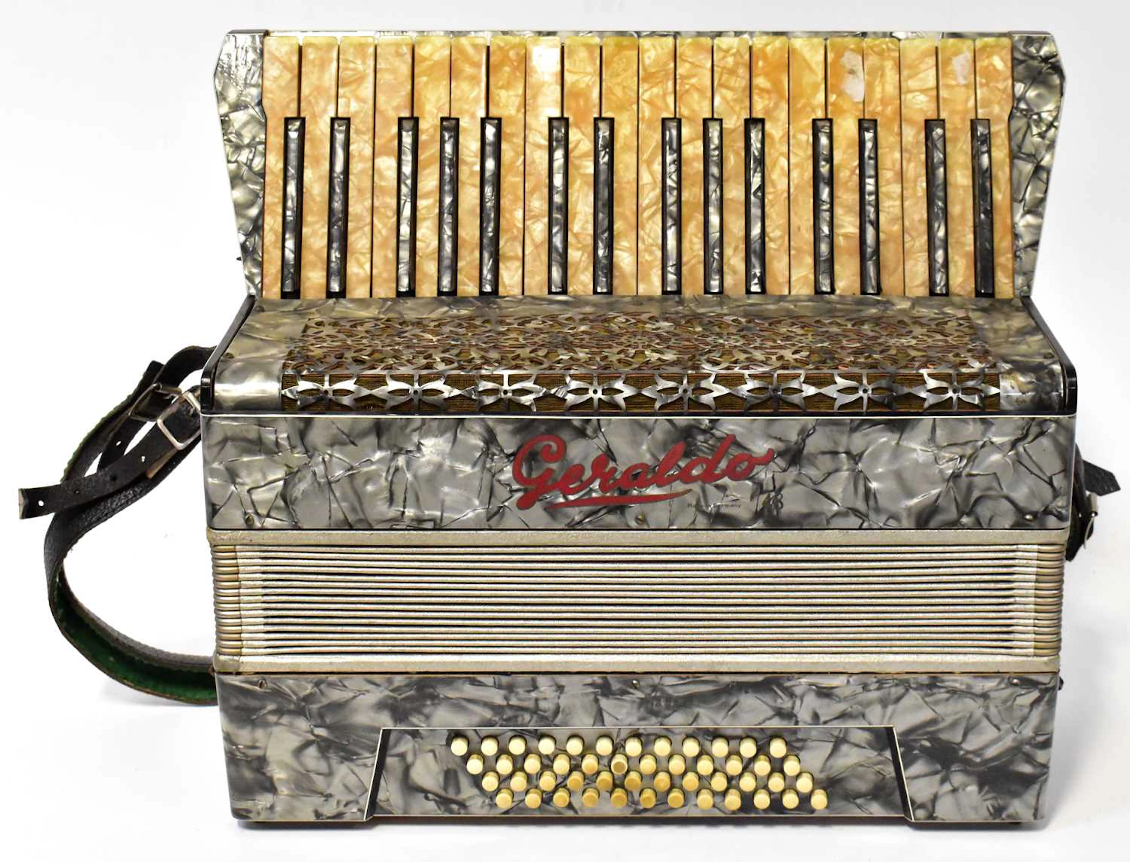 A Geraldo piano accordion in grey with mother-of-pearl effect outer and keys