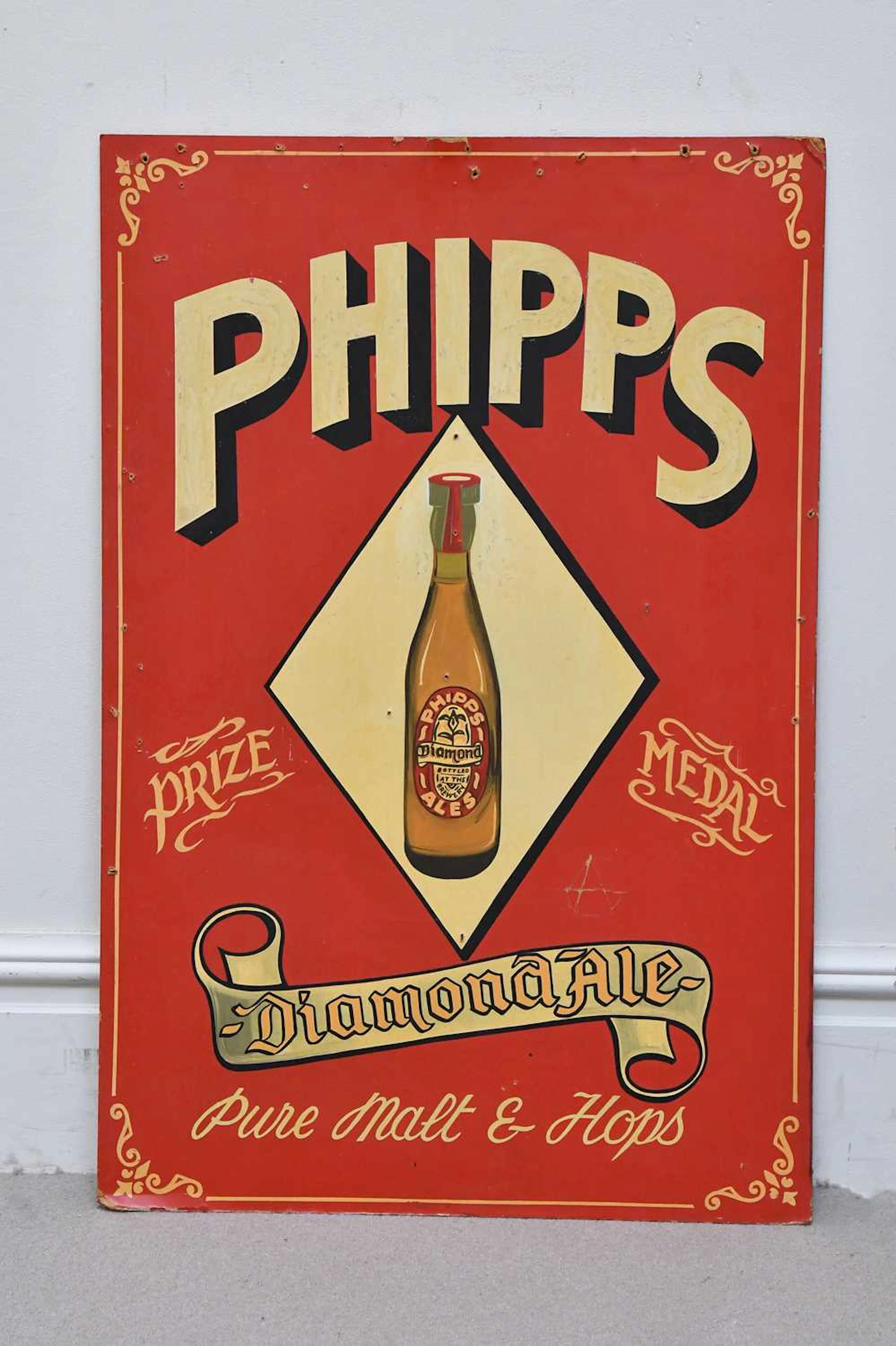A Phipps Diamond Ale painted sign