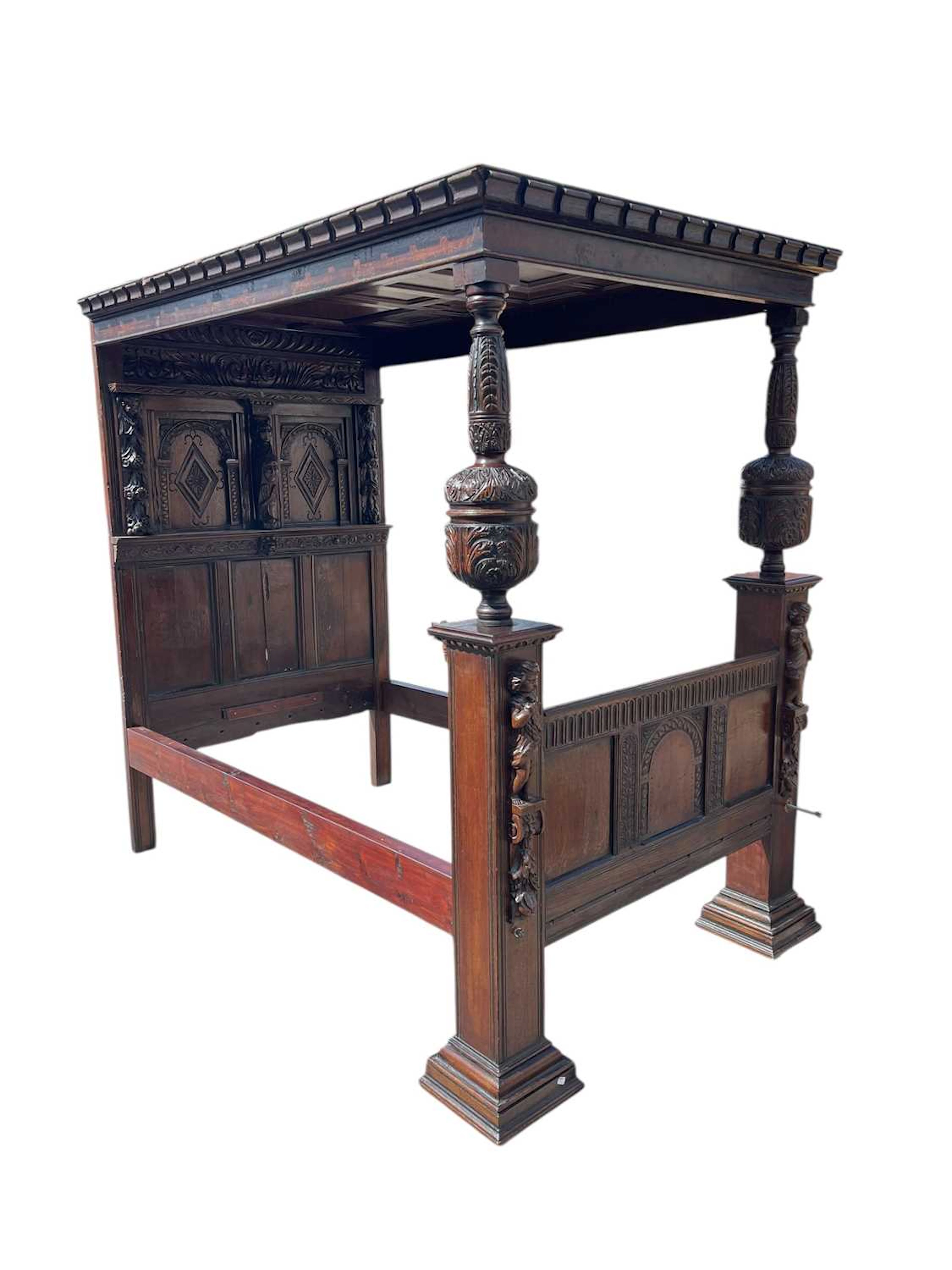 A 17th century carved oak four poster bed