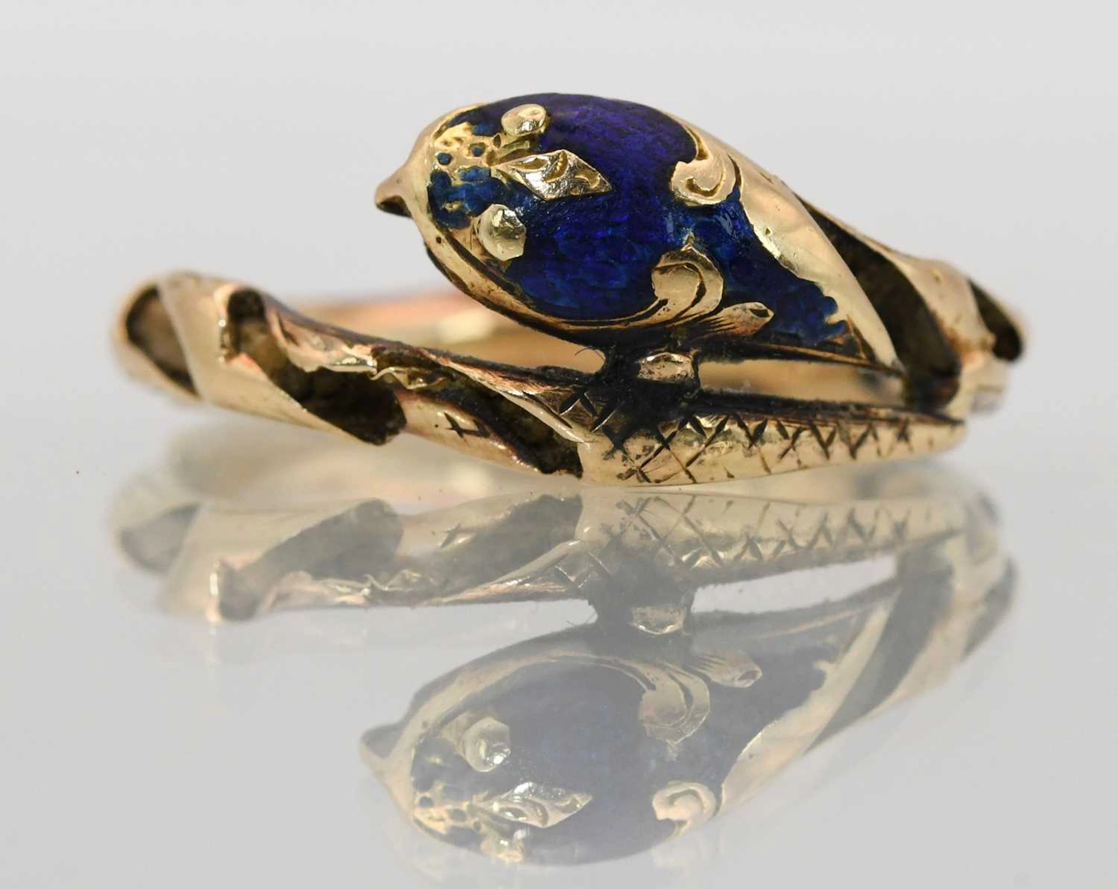 An interesting antique yellow metal blue enamelled serpent ring