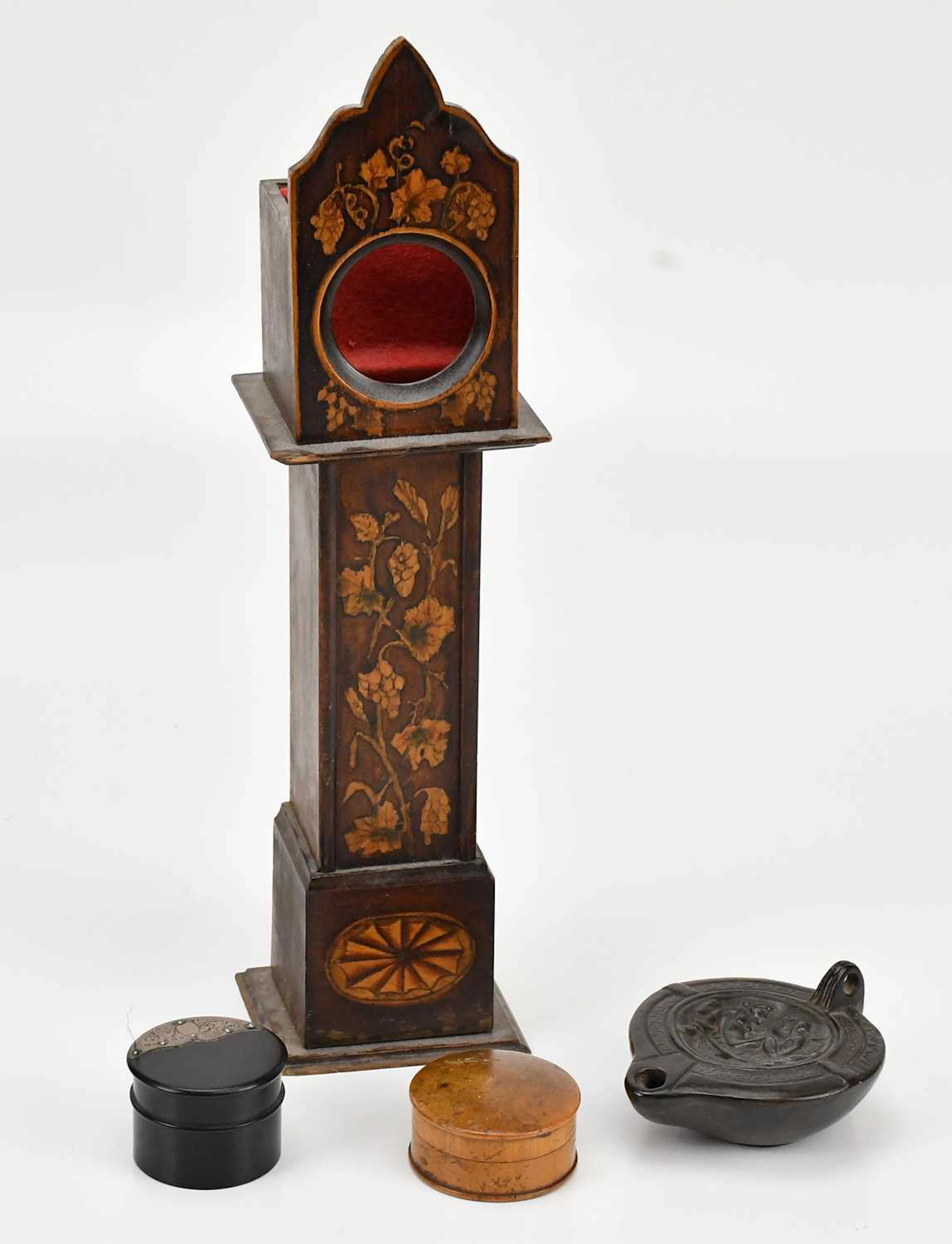 An early 20th century pocket watch stand formed as a longcase clock
