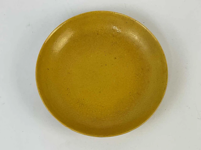 A Chinese yellow glazed dish