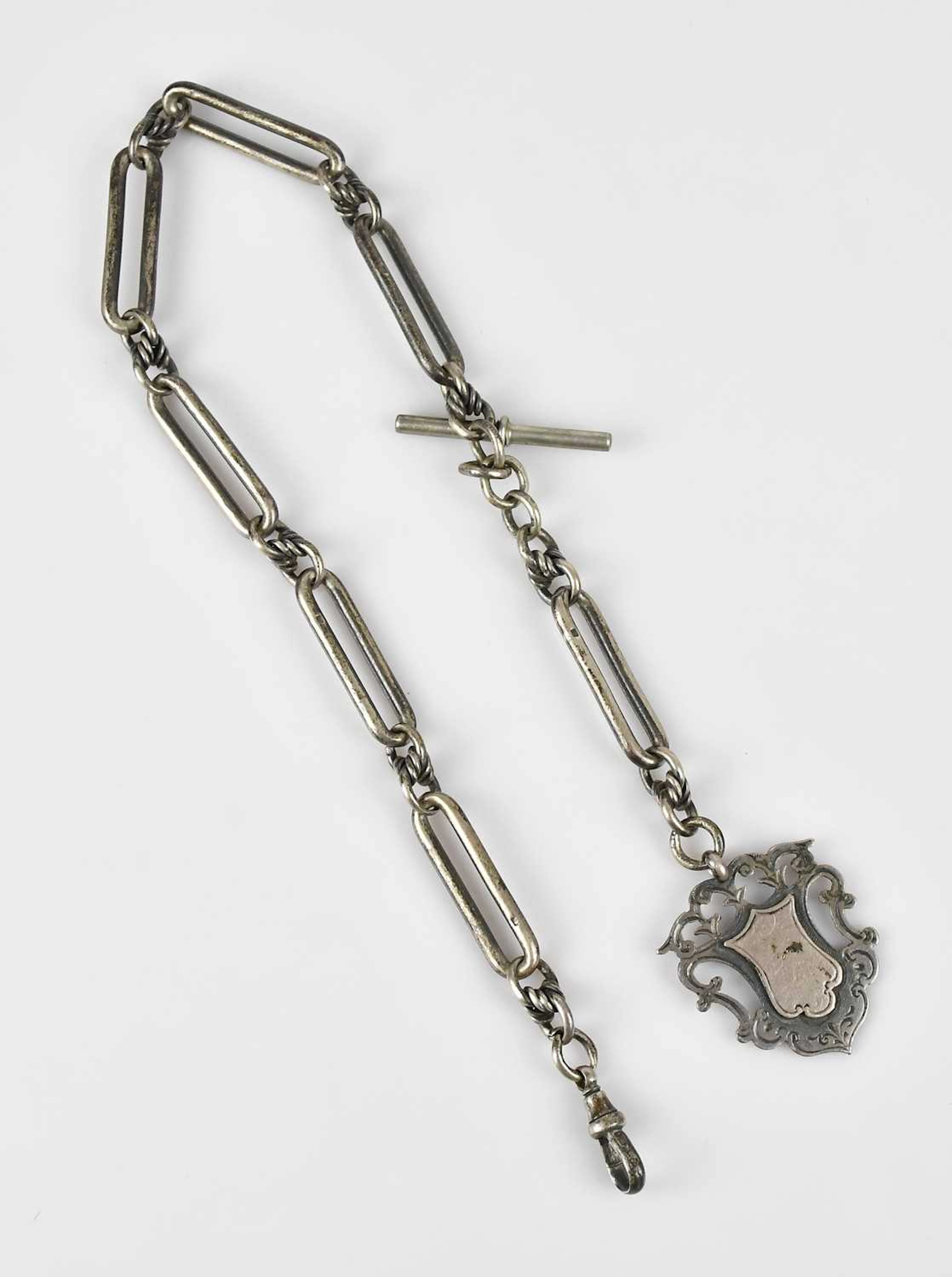 A hallmarked silver trombone link Albert chain