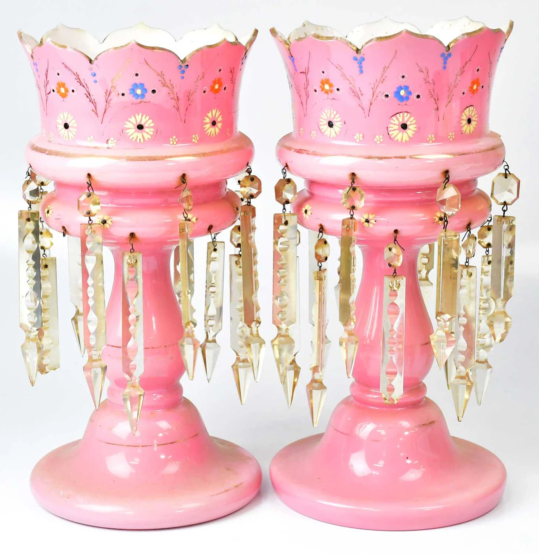 Two pink glass lustres each with cut glass drops