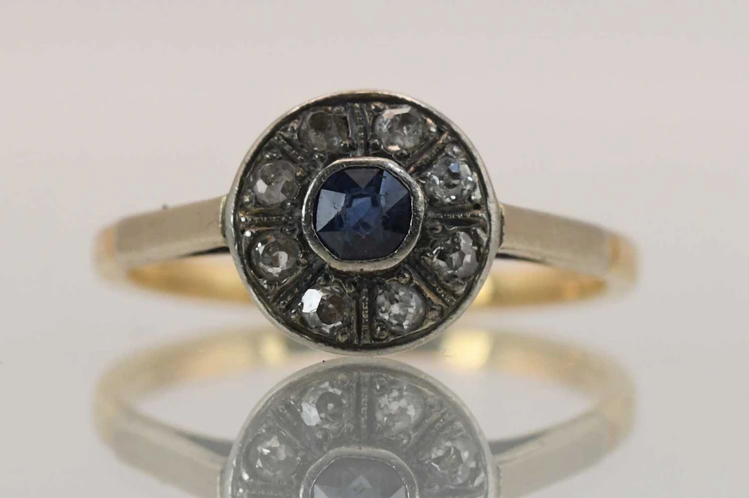 An early 20th century Art Deco sapphire and diamond set cluster ring