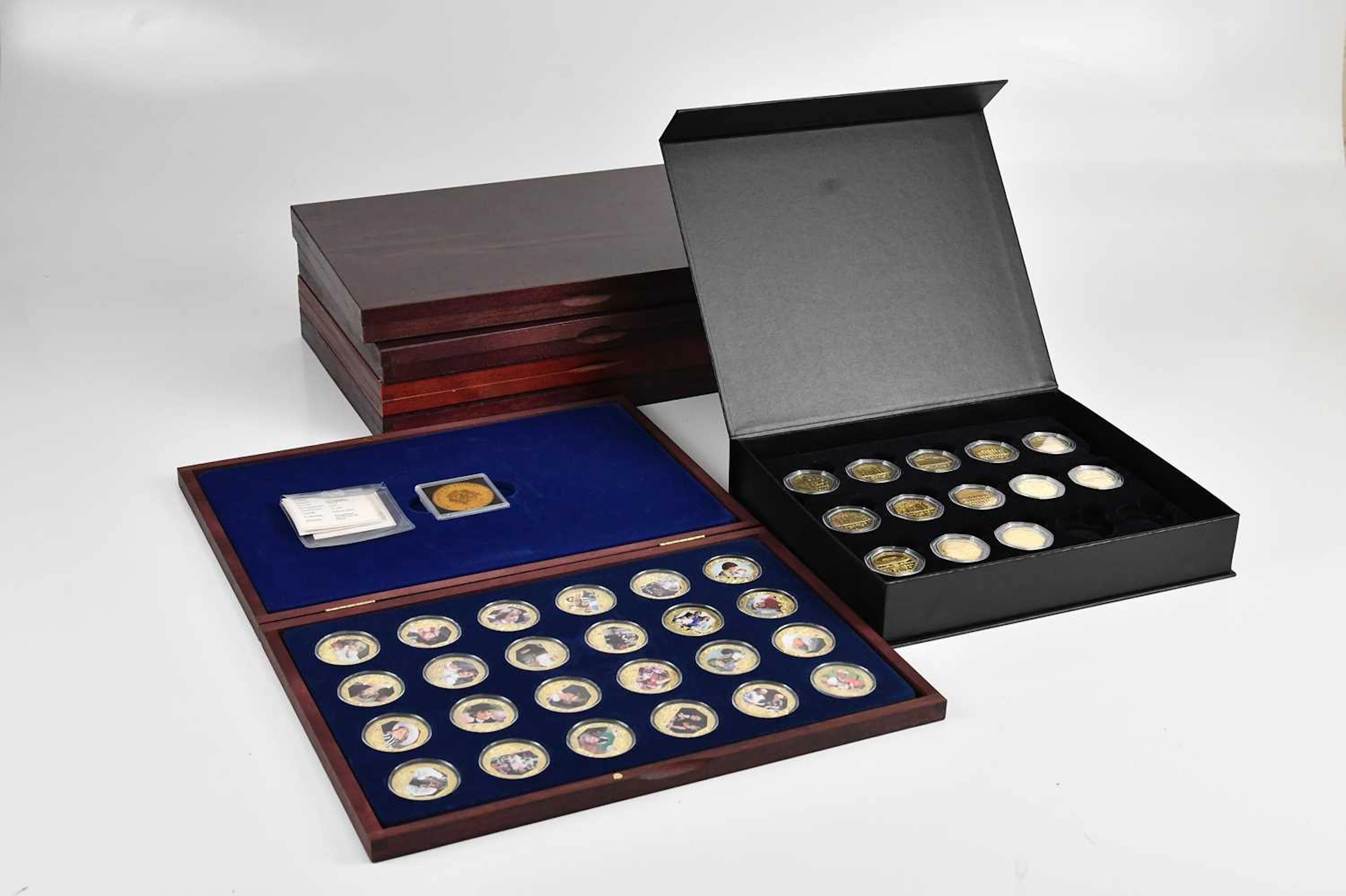 A collection of commemorative boxed coins comprising...