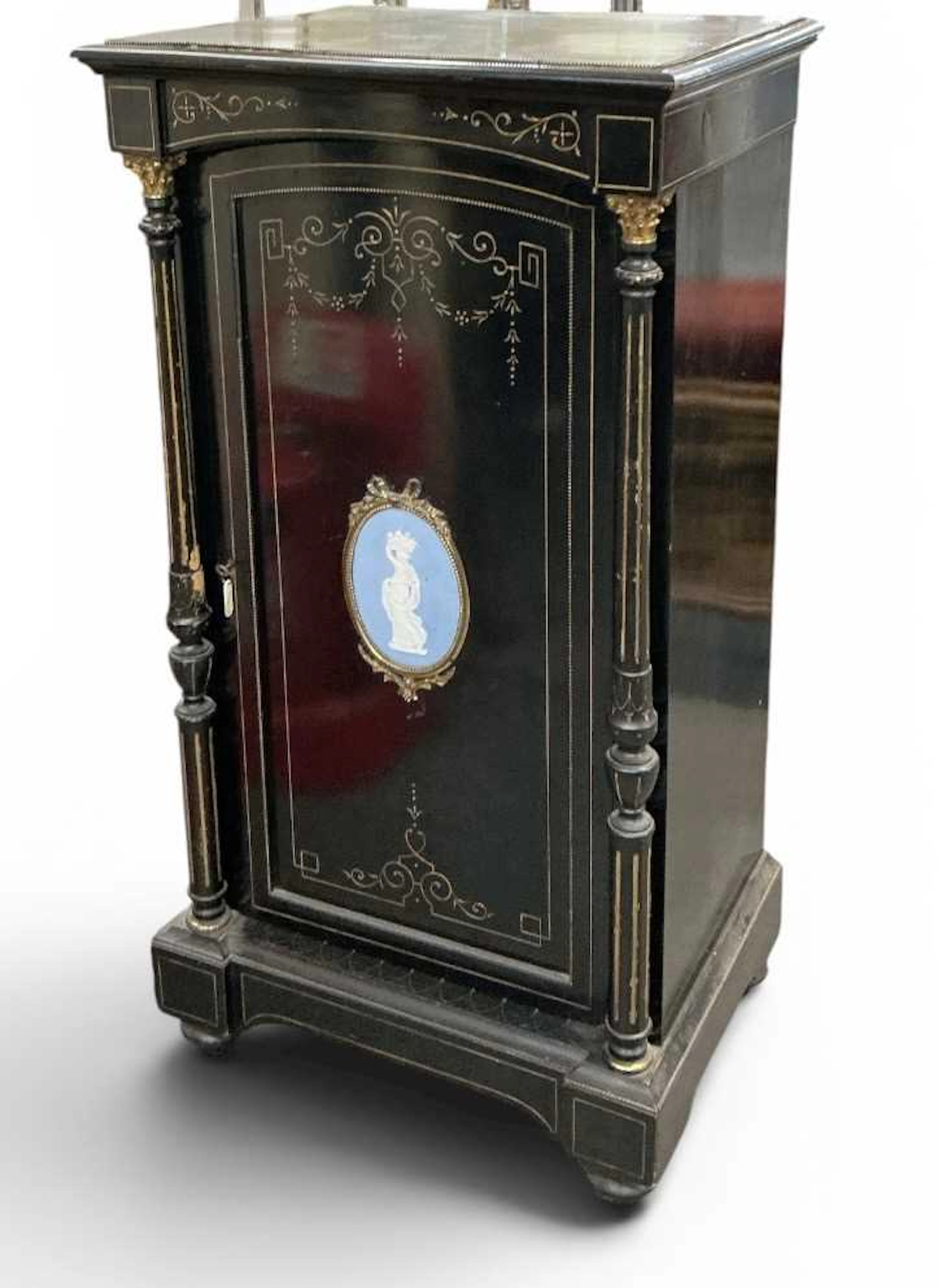 A late 19th century French ebony gilt metal ormolu mounted music/side cabinet