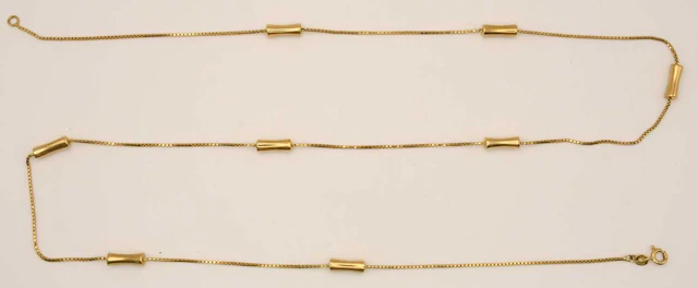 A 9ct yellow gold necklace with eight pillow links between small box chain