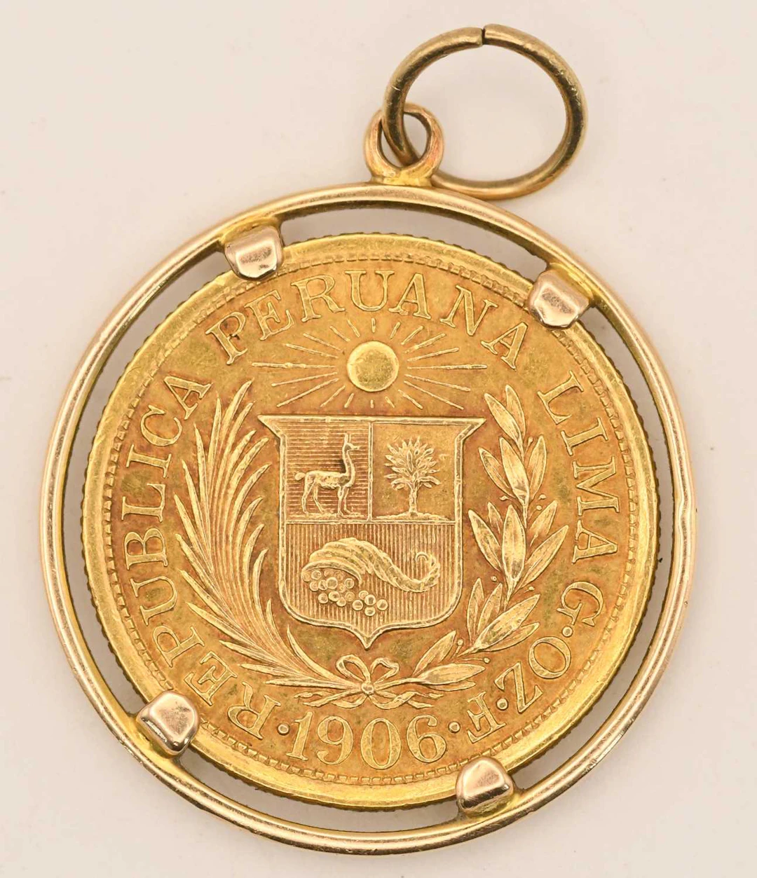 A Peruvian 1906 one libra gold coin