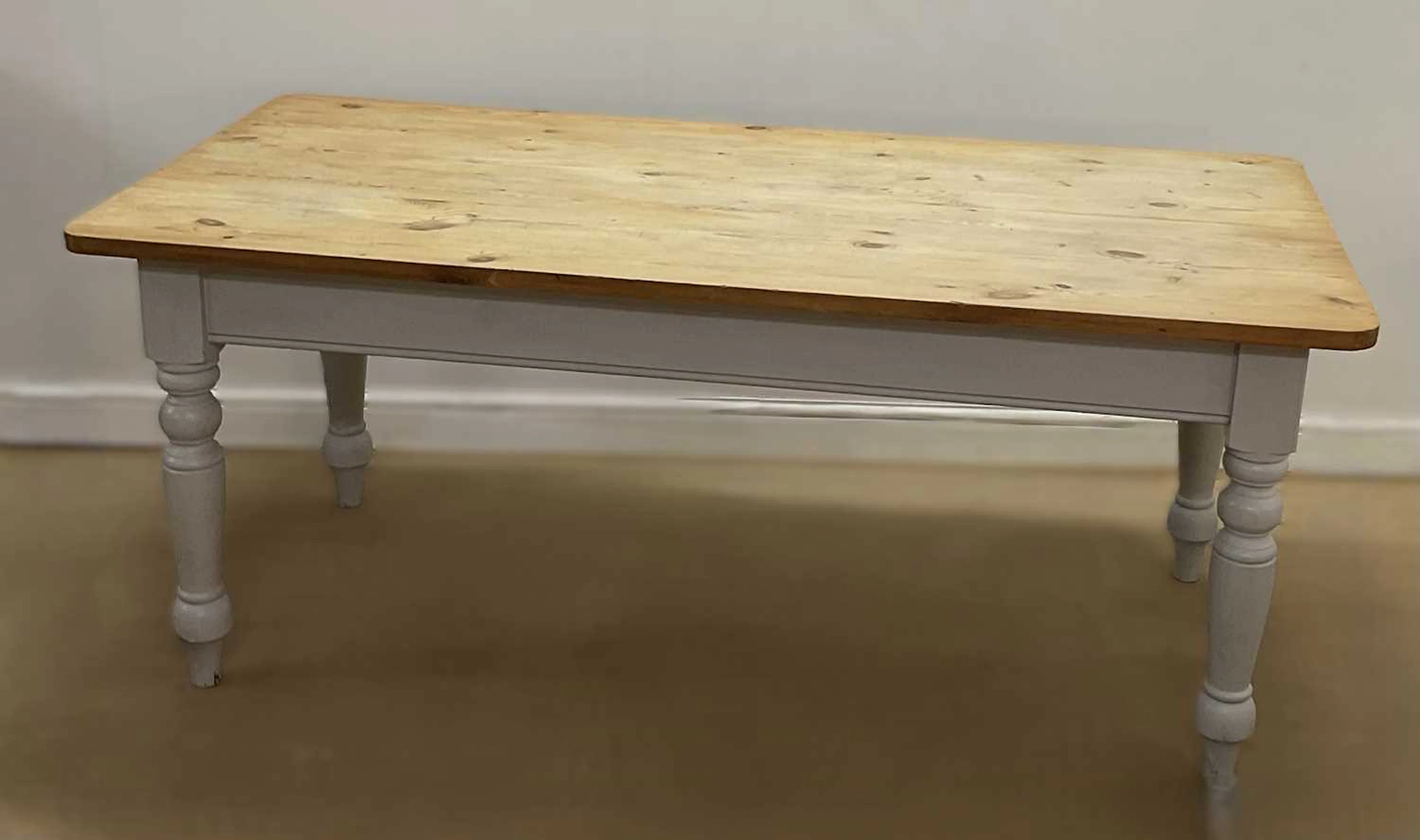 A 20th century pine refectory table with painted legs