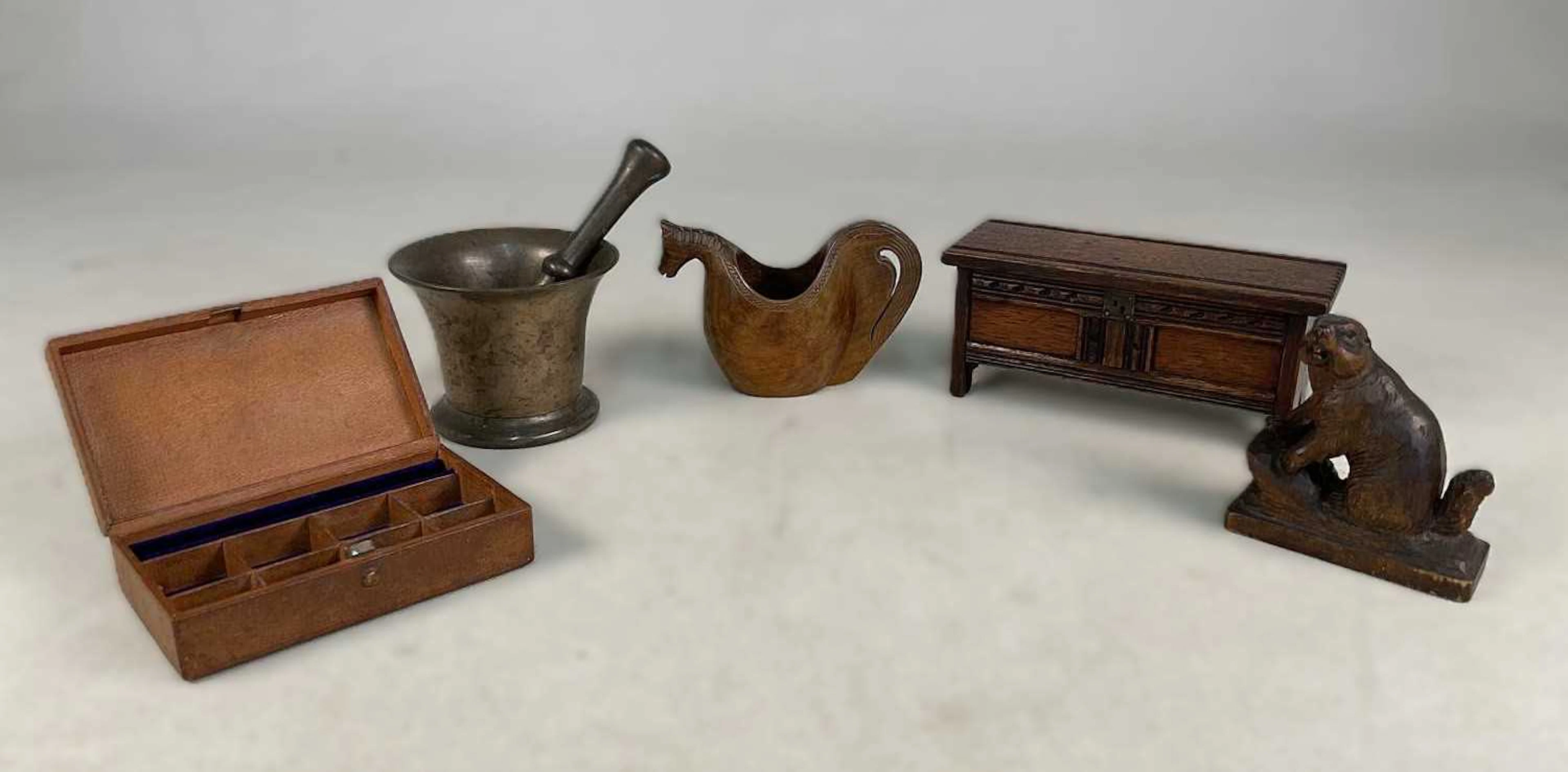 A collectors' lot comprising a brass pestle and mortar