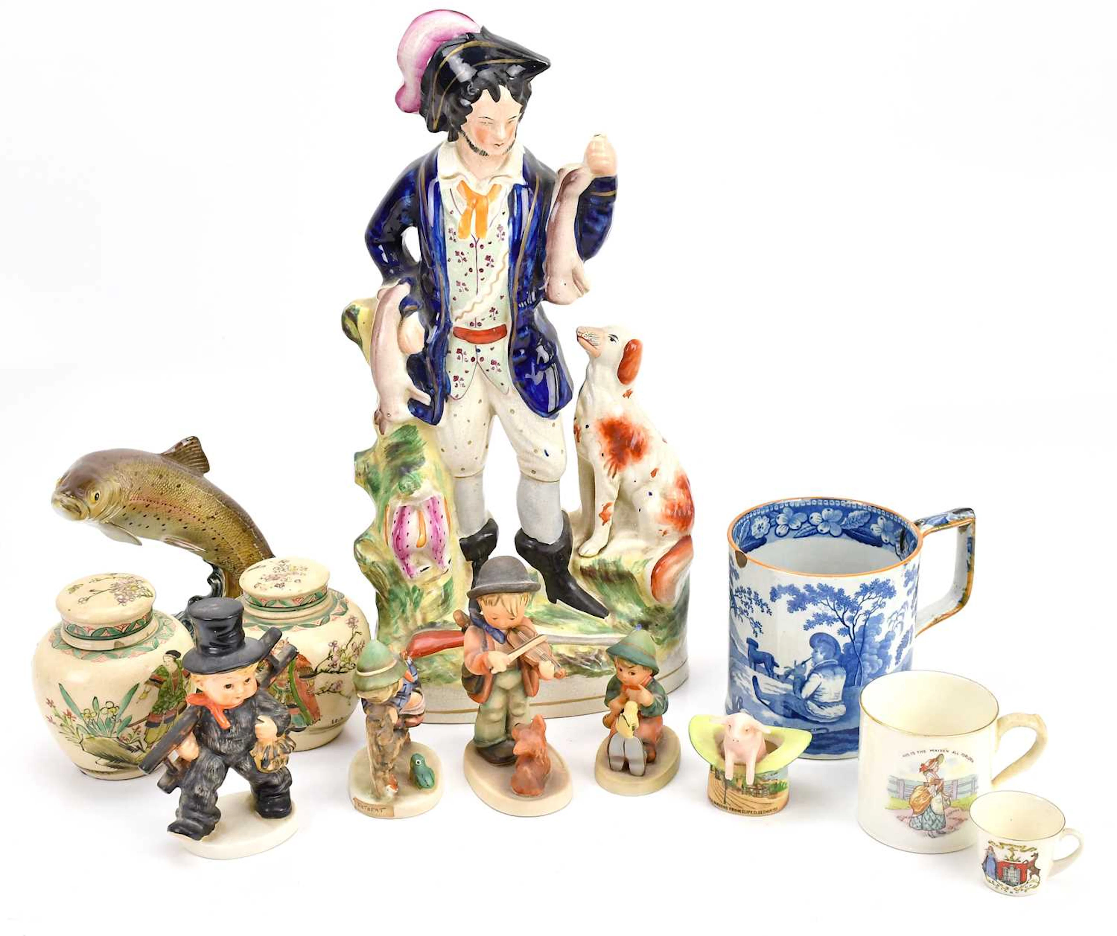 A tall Staffordshire figure of a huntsman