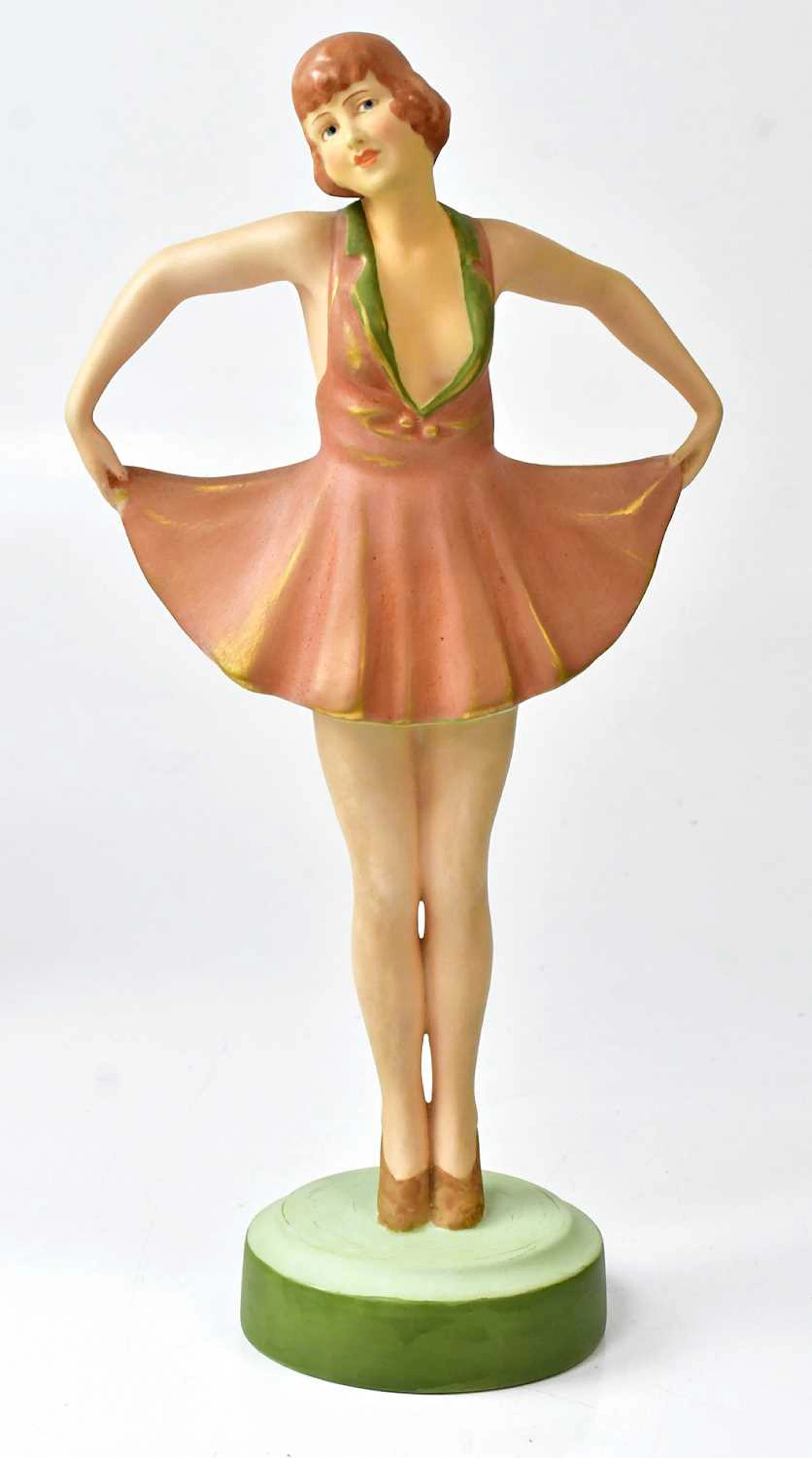 A Czechoslovakian ceramic figure of a young woman in a short skirt