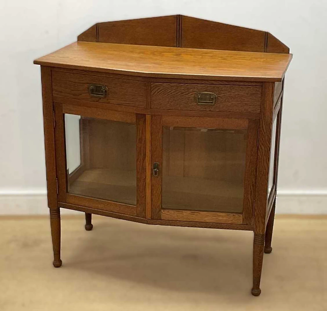 An early 20th century oak glazed cabinet